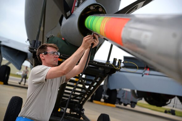 U.S. Air Force Staff Sgt. James Harris, 100th Maintenance Squadron hydraulics technician from Abilene, Texas, prepares to service surge boots within a KC-135 Stratotanker boom Aug. 11, 2015, on RAF Mildenhall, England. Surge boots are rubber-like sleeves that run the length of the fuel tube, used as a way to prevent damage during fuel surges when the boom disconnects from the aircraft it is refueling. (U.S. Air Force photo by Senior Airman Christine Halan/Released)