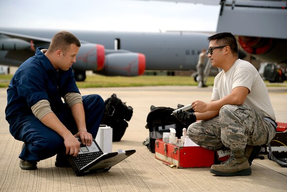 U.S. Air Force Senior Airman Robert Summerville, left, 100th Maintenance Squadron hydraulics technician from New Castle, Penn., and U.S. Air Force Staff Sgt. Albert Salangsang, 100th MXS hydraulics technician from Dallas, verify they have the proper equipment and chemicals for an inspection on a KC-135 Stratotanker Aug. 11, 2015, on RAF Mildenhall, England. Airmen were doing this as part of a required inspection to ensure the aircraft stays mission ready. (U.S. Air Force photo by Senior Airman Christine Halan/Released)
