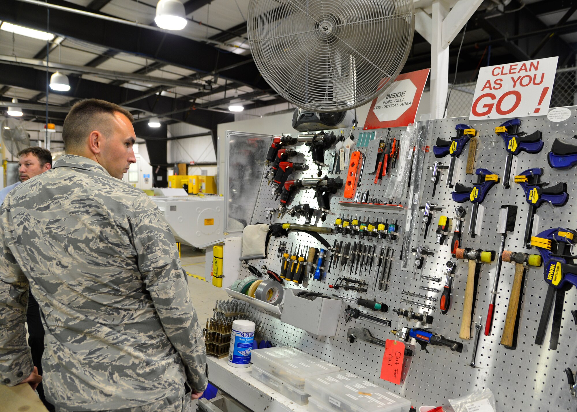 Capt. Derrick Besse, 436th Aircraft Maintenance Squadron operations officer, looks at a tool shadow board during a tour of the PATS Aircraft Systems facility Aug. 5, 2015, in Georgetown, Del. The tour highlighted lean principles enacted by PATS to maximize their output and limit the amount of waste within their operations. (U.S. Air Force photo/Airman 1st Class William Johnson)