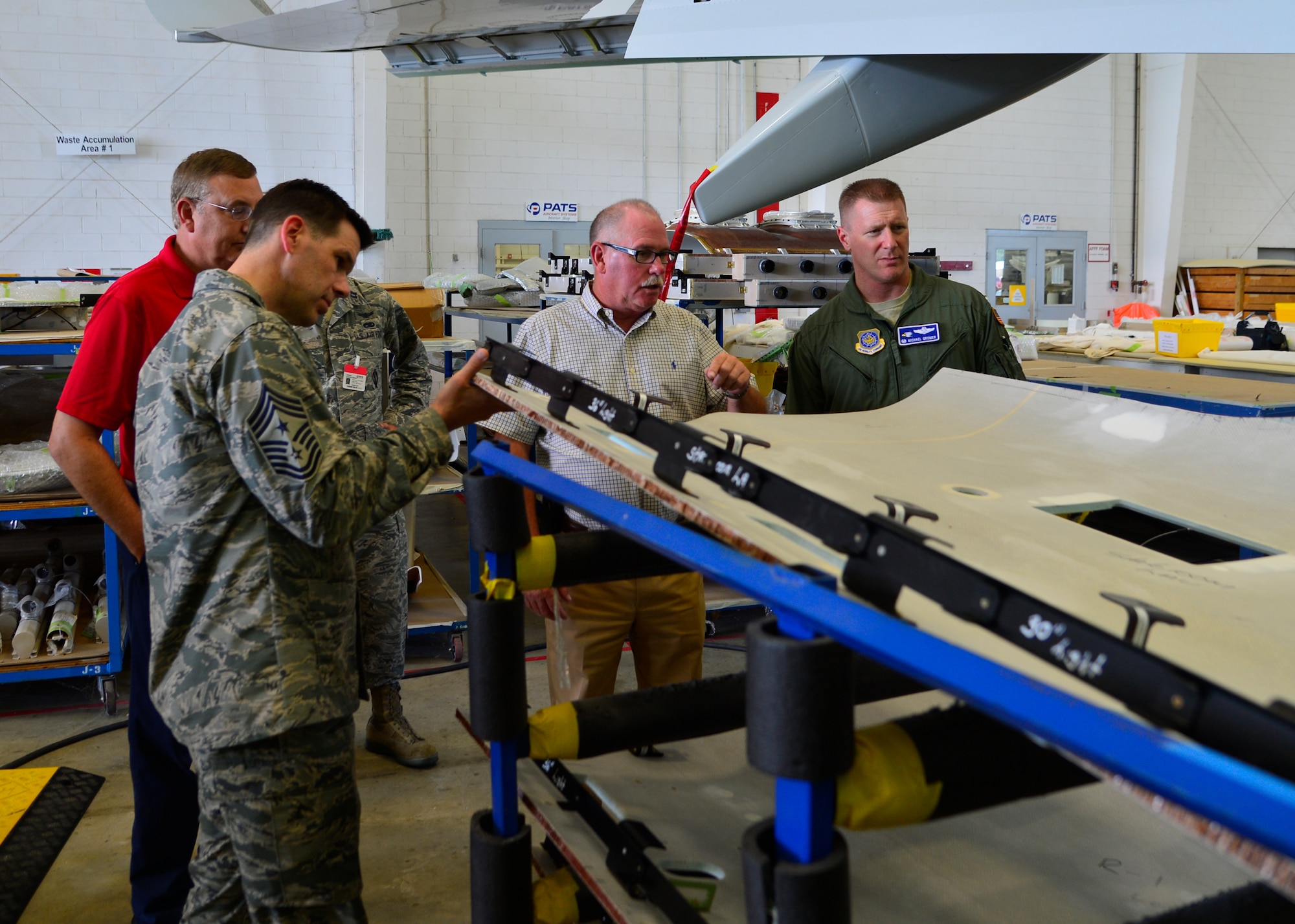 Mark Ryan, PATS Aircraft Systems vice president of Business Boeing Jets and hangar programs, showcases an interior panel of a plane during a tour of the PATS Aircraft System facility Aug. 5, 2015, in Georgetown, Del. PATS specializes in designing and installing upgrade aircraft interior components for world-wide customers. (U.S. Air Force photo/Airman 1st Class William Johnson)