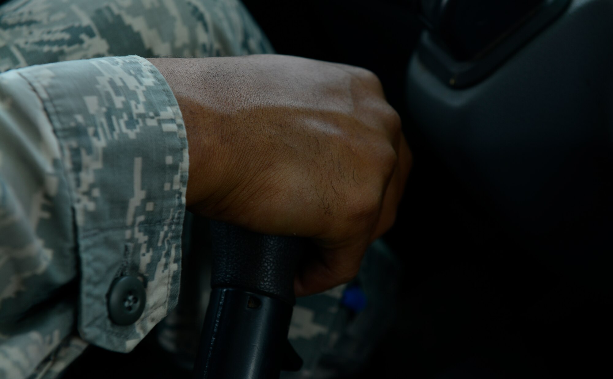 Airman 1st Class Fred Jones, 786th Civil Engineer Squadron heavy equipment operator, shifts gears while operating a tractor trailer vehicle during the Air Force Civil Engineer Center Tractor Trailer Training program Aug. 10, 2015, at Ramstein Air Base, Germany. This is the first time this program is being taught in U.S. Air Forces in Europe. In it, students learn tractor trailer general knowledge, vehicle inspections, shifting proficiency, advanced backing maneuvers and over-the-road operating skills.  (U.S. Air Force photo/Airman 1st Class Tryphena Mayhugh)