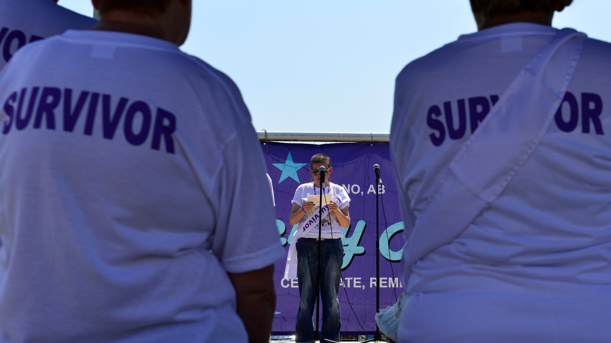Carlotta Schiavon, a non-profit medical assistance company representative, delivers a speech before the start of a Relay for Life event, Aug. 7, 2015, at Aviano Air Base, Italy. Schiavon spoke about her personal experiences battling cancer and how others can continue to stay strong through hardships. (U.S. Air Force photo by Airman 1st Class Cary Smith/Released)