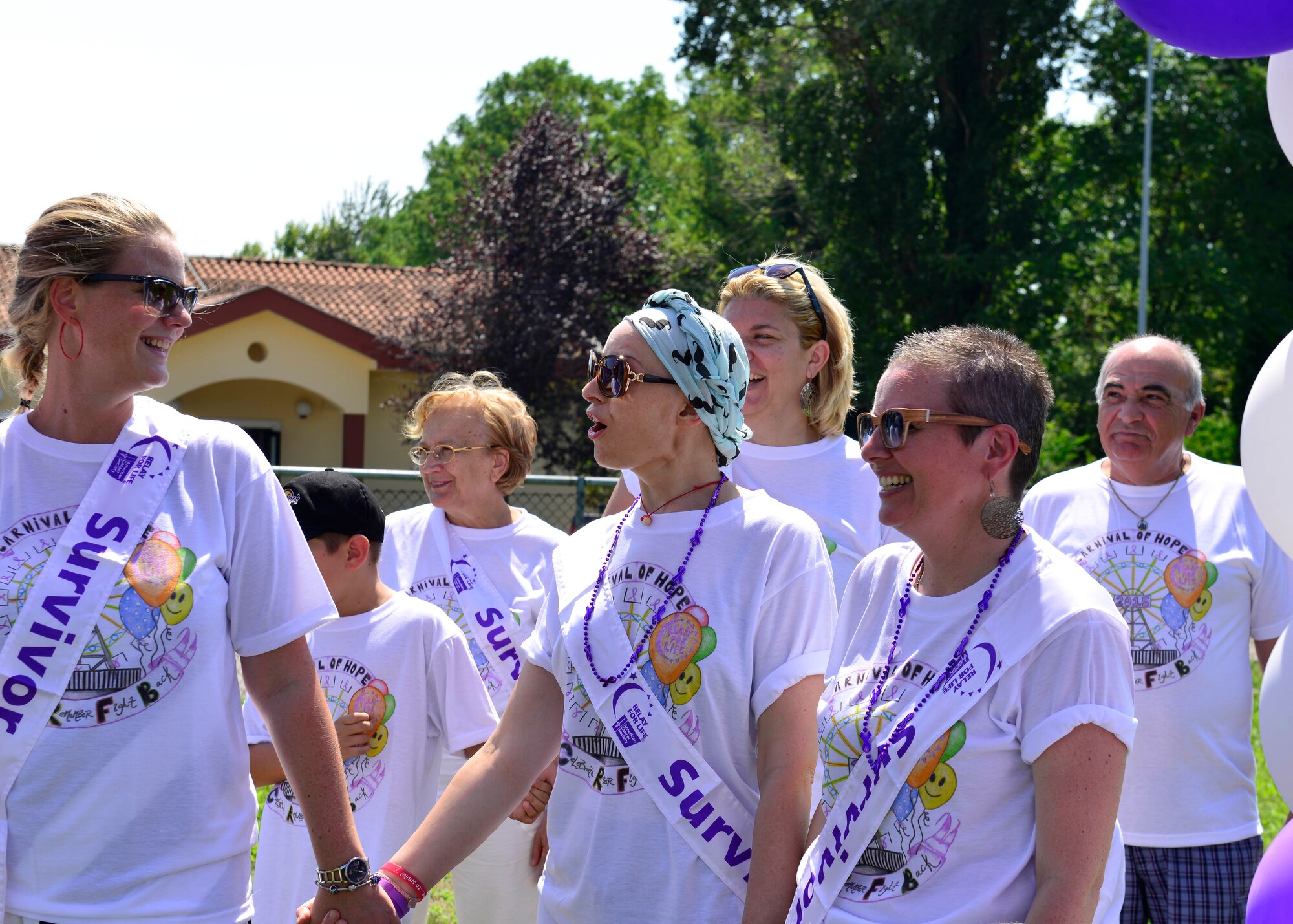 Local Italian cancer survivors wait for the Relay for Life kickoff, Aug. 7, 2015, at Aviano Air Base, Italy. The 24-hour event started with introductory speeches and a first lap by Aviano’s honor guard followed by cancer survivors. (U.S. Air Force photo by Airman 1st Class Cary Smith/Released)