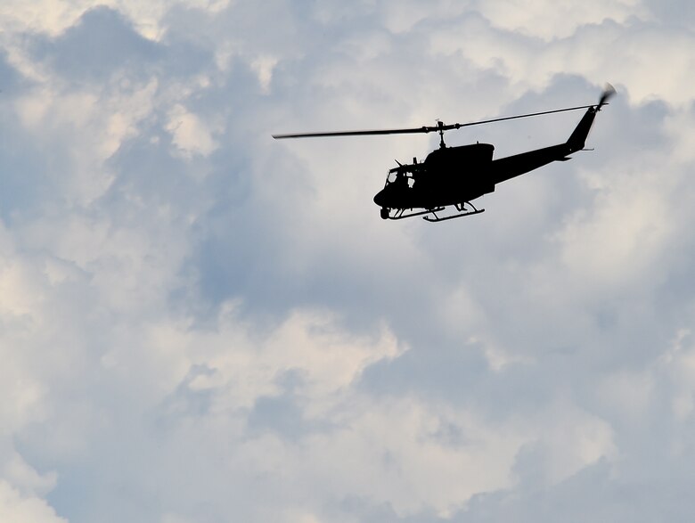 A UH-1N Huey helicopter belonging to the Minot Air Force Base’s 54th Helicopter Squadron is silhouetted against gathering clouds over the plains of Wyoming Aug. 10, 2015, during the annual 2015 Global Strike Challenge helicopter competition. Teams from the three flying squadrons of the 582nd Helicopter Group showed off their skill and adaptability when it comes to protecting the nation’s ICBM assets. (U.S. Air Force photo by R.J. Oriez/Released)