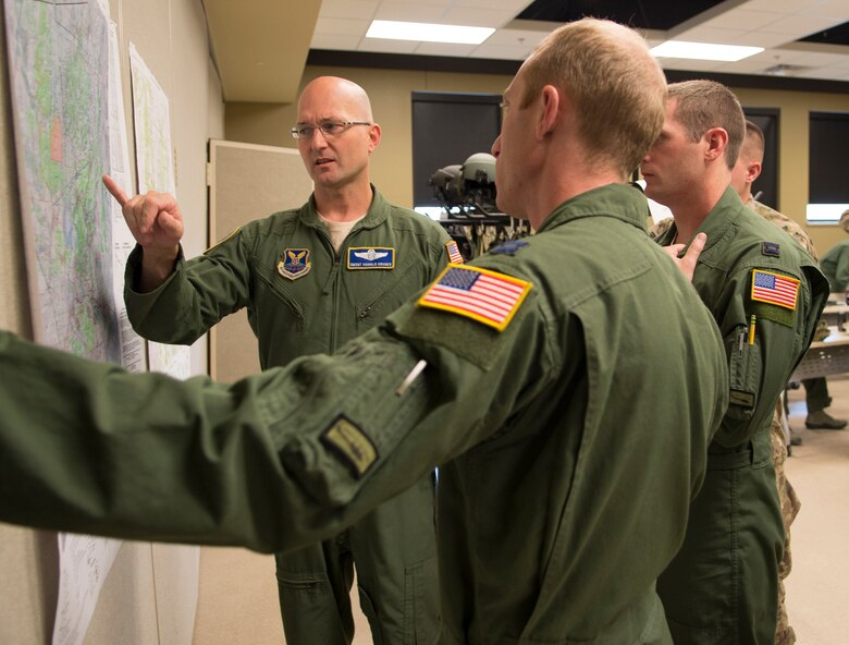 Senior Master Sgt. Harold Kruger, Air Force Global Strike Command helicopter operations, gives guidance to competitors for the Global Strike Challenge.  Information given to the crews focused on details the helicopter crews would need for their familiarization flights later that day. Familiarization flights allowed crews from the 37th, 40th and 54th Helicopter Squadrons to learn the lay of the land around Camp Guernsey, Wyo., before the competition. (U.S. Air Force photo by Airman 1st Class Malcolm Mayfield/Released)