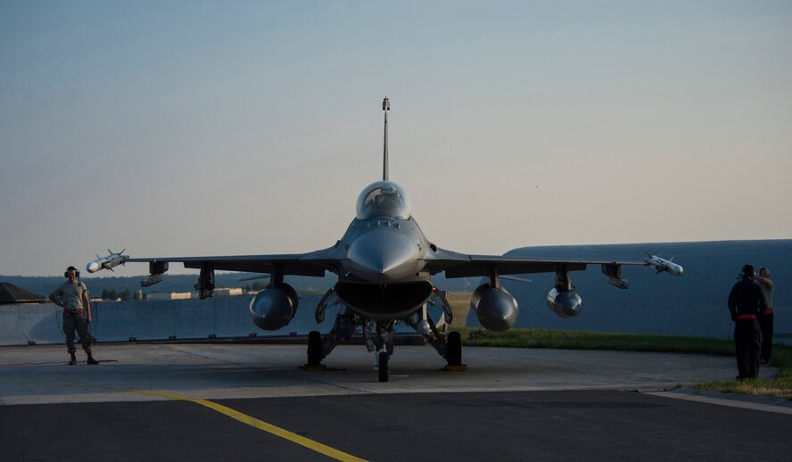 U.S. Air Force Airmen assigned to the 52nd Aircraft Maintenance Squadron stands alongside an F-16 Fighting Falcon fighter aircraft as the pilot shuts down the engine at Spangdahlem Air Base, Germany, Aug. 11, 2015. The pilot participated in Red Flag, the U.S. Air Force’s premier air-to-air combat training exercise at Nellis Air Force Base, Nev., July 13-31, 2015. (U.S. Air Force photo by Airman 1st Class Luke Kitterman/Released)
