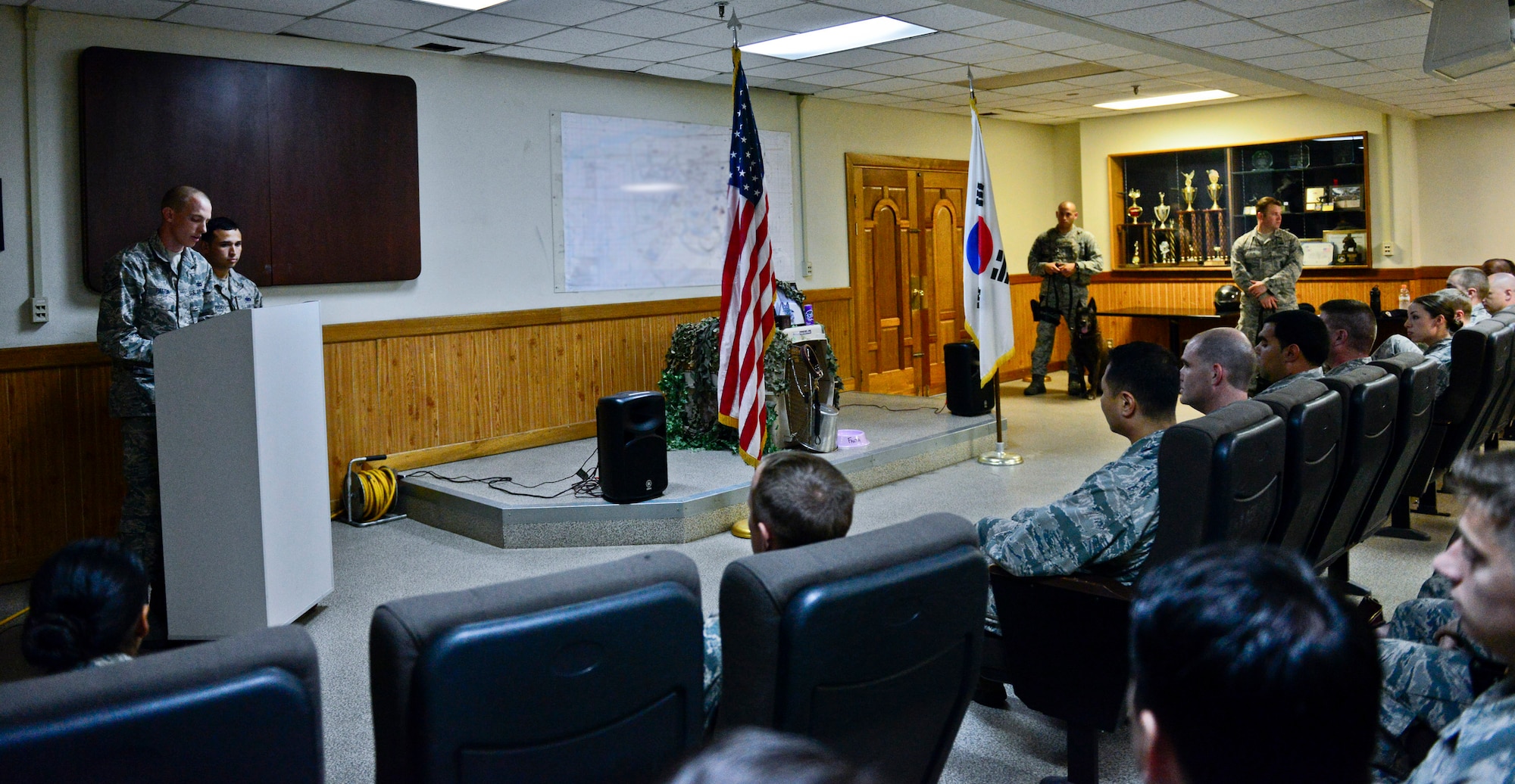 Airmen and military working dogs from the 51st Security Forces Squadron, gather to honor MWD Fanta on Aug. 10, 2015 on Osan Air Base, South Korea. MWD Fanta served eight years in active service as a patrol dog. (U.S. Air Force photo/Senior Airman Kristin High)