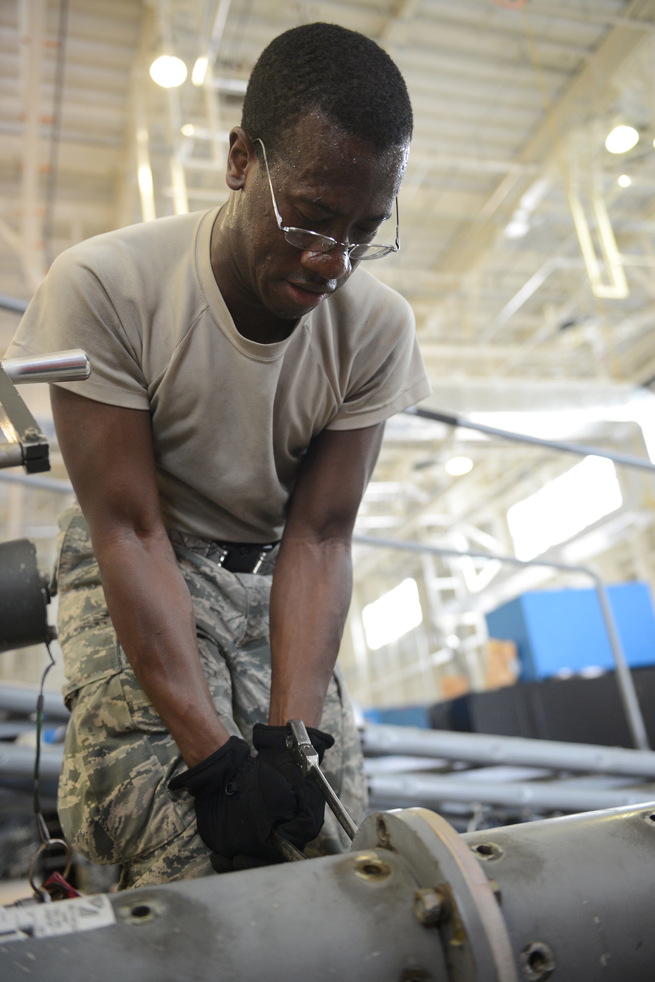 Airman 1st Class Eliyah Hammond, 374th Maintenance Squadron aerospace ground equipment journeyman, removes nuts and bolts from a tow bar as part of an inspection at Yokota Air Base, Japan, Aug. 12, 2015. Preventative maintenance inspections help ensure the operational serviceability of equipment.  (U.S. Air Force photo by Senior Airman David C. Danford/Released)
