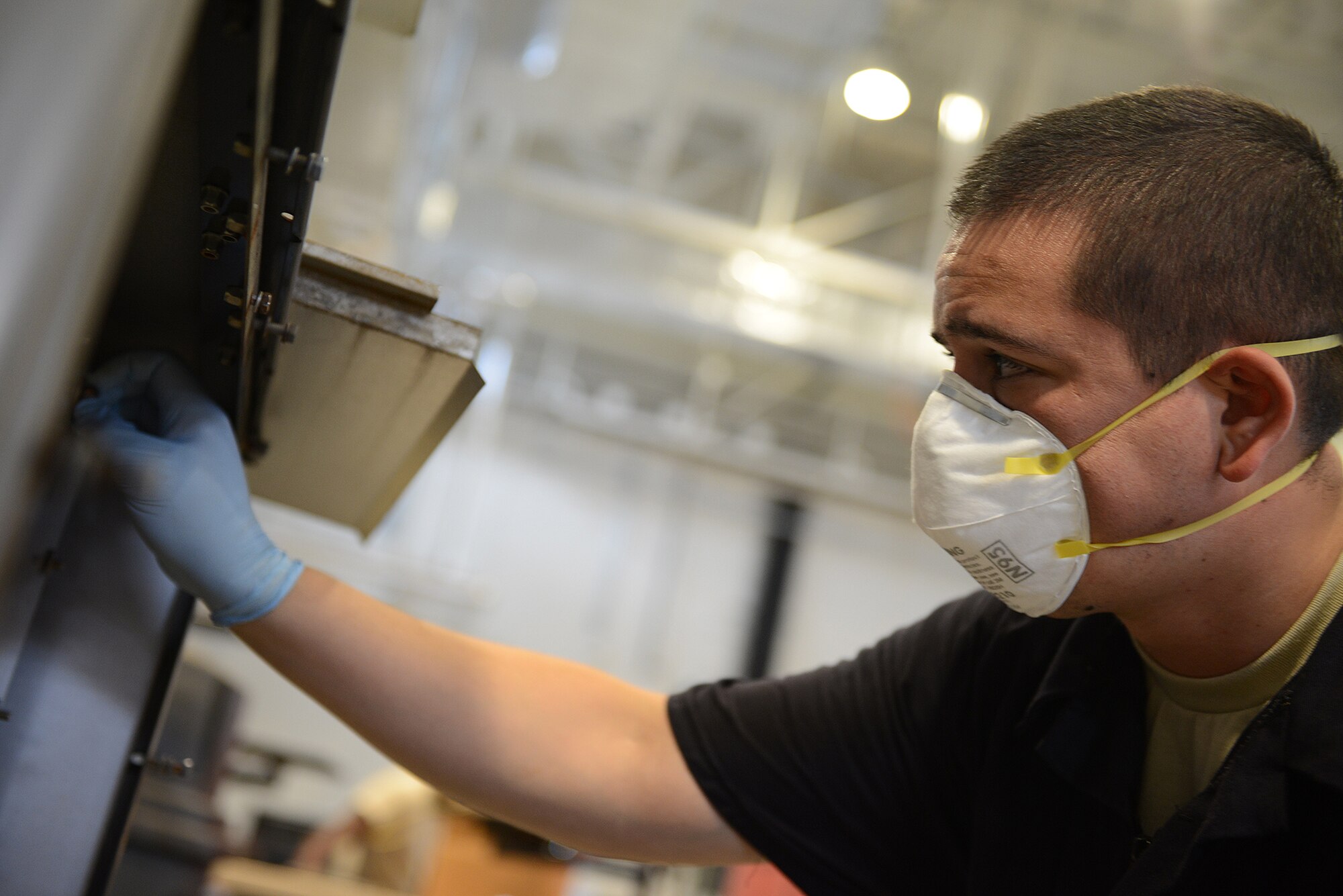 Staff Sgt. David Chandler, 374th Maintenance Squadron aerospace ground equipment craftsman, removes a panel from a new generation heater at Yokota Air Base, Japan, Aug. 12, 2015. Preventative maintenance inspections help ensure operational serviceability of equipment. (U.S. Air Force photo by Senior Airman David C. Danford/Released)