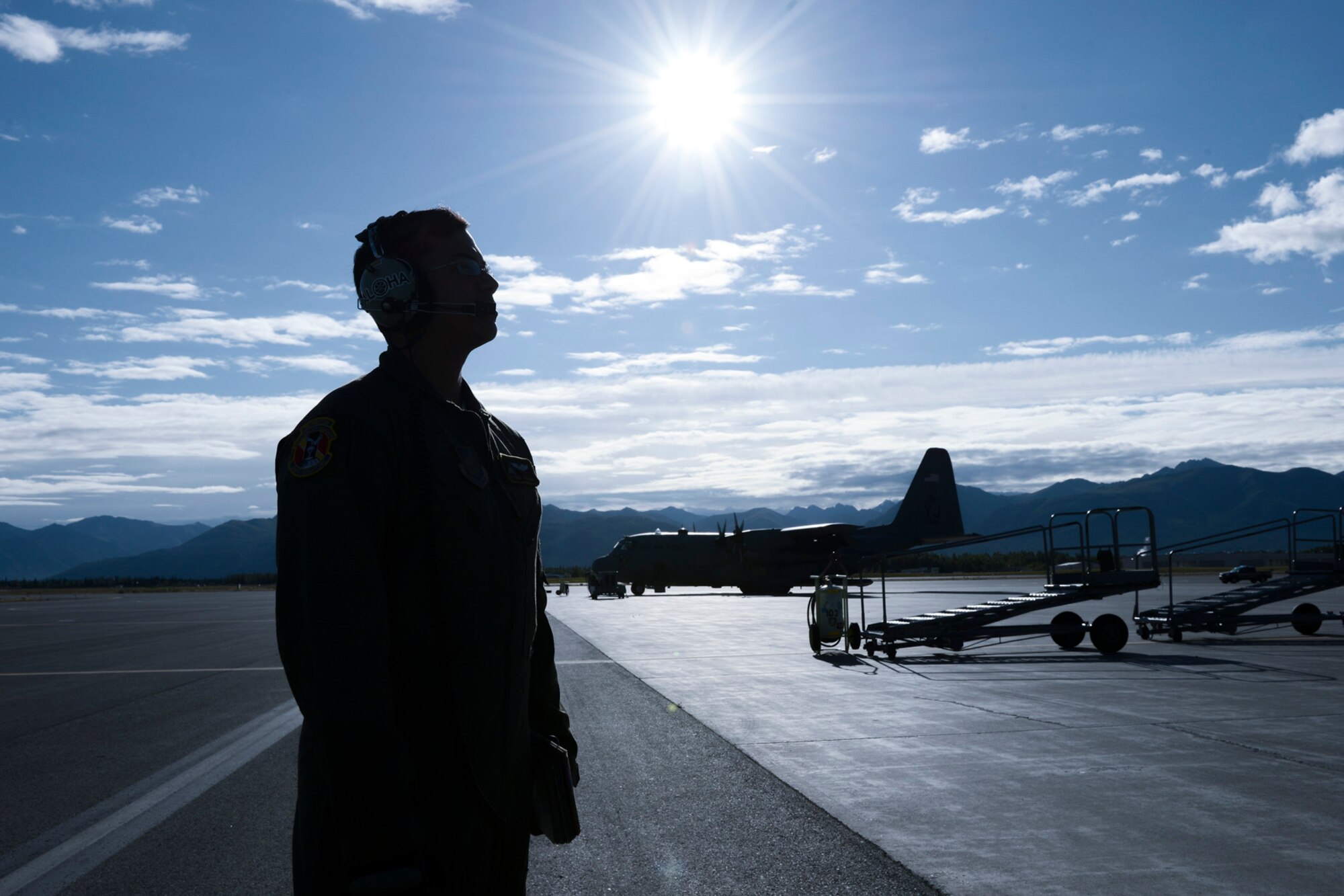 U.S. Air Force Senior Airman Jeremy Jutba-Hake, 36th Airlift Squadron loadmaster, conducts pre-flight checks during Red Flag-Alaska at Joint Base Elmendorf-Richardson, Alaska, Aug. 11, 2015. Red Flag-Alaska is an exercise that provides joint offensive counter-air, interdiction, close air support and large force employment training in a simulated combat environment. More than 20 allied countries have participated in Red Flag-Alaska since its conception, improving integration, interoperability and cross-cultural competence. (U.S. Air Force photo by Staff Sgt. Cody H. Ramirez/Released)