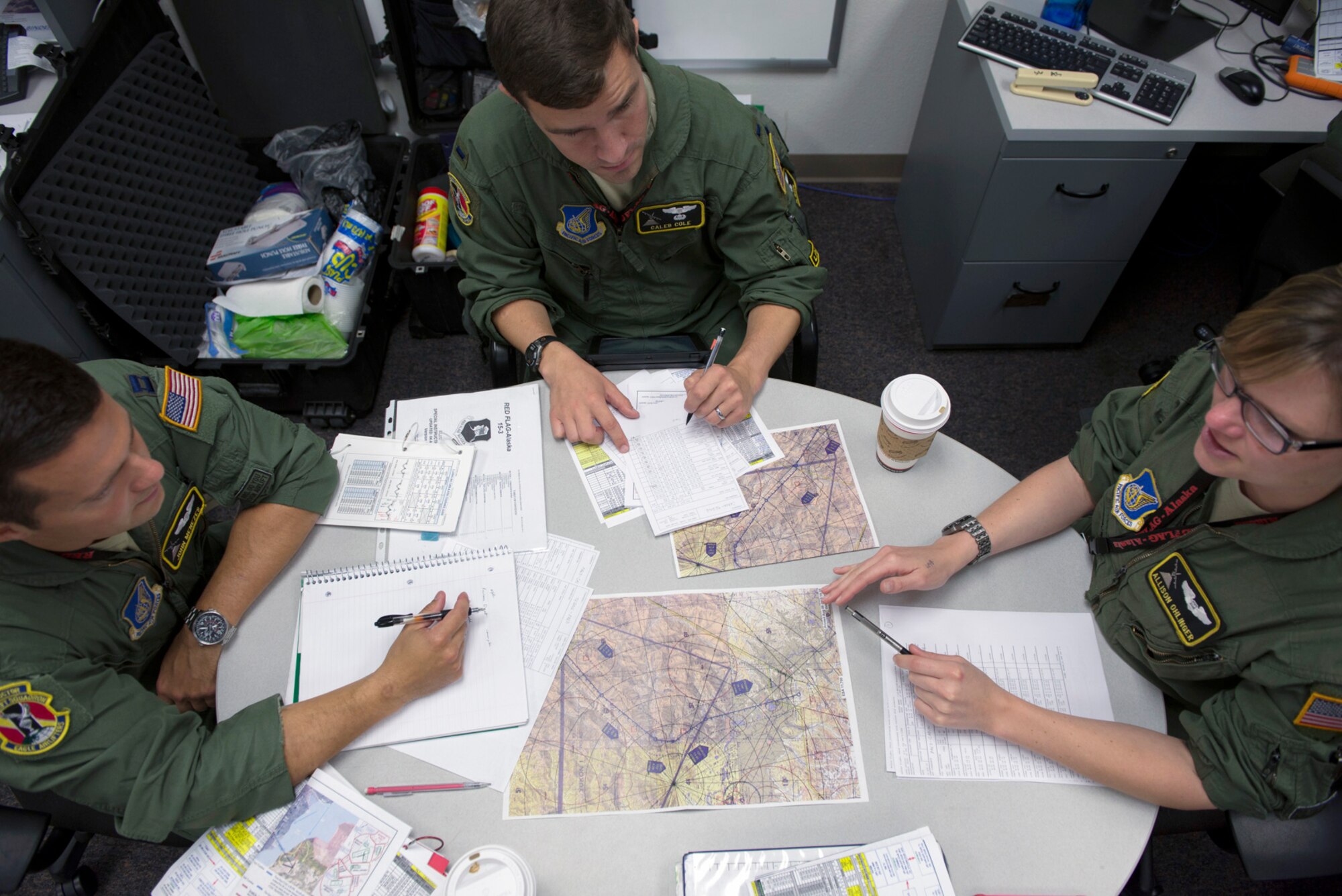 Aircrew with the 36th Airlift Squadron conduct mission planning during Red Flag-Alaska at Joint Base Elmendorf-Richardson, Alaska, Aug. 10, 2015. Red Flag-Alaska is an exercise that provides joint offensive counter-air, interdiction, close air support and large force employment training in a simulated combat environment. More than 20 allied countries have participated in Red Flag-Alaska since its conception, improving integration, interoperability and cross-cultural competence. (U.S. Air Force photo by Staff Sgt. Cody H. Ramirez/Released)