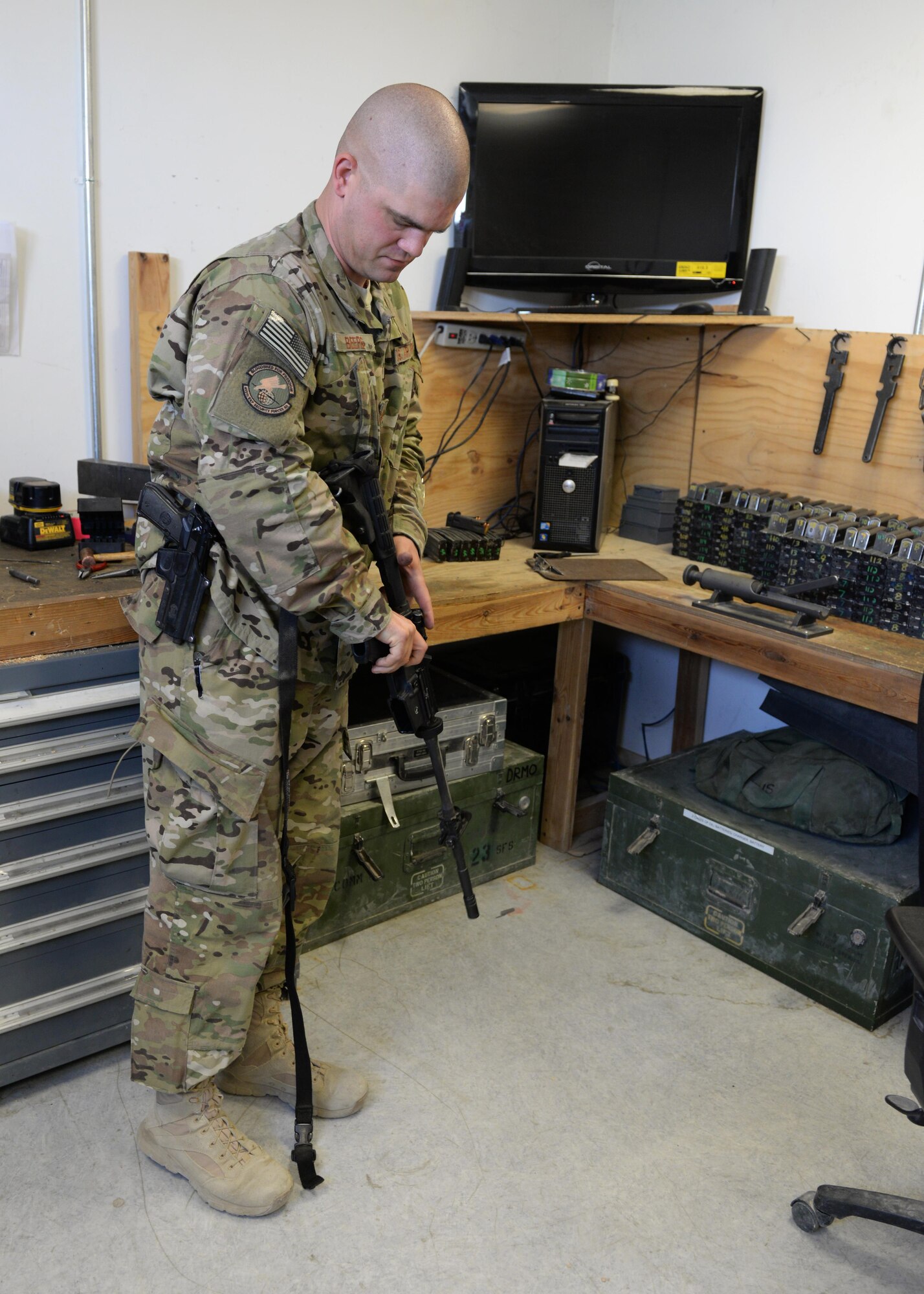 U.S. Air Force TSgt. Kevin Beers, 455th Expeditionary Security Forces Squadron combat arms instructor, conducts a function check on a M-4 rifle Aug. 10, 2015, at Bagram Airfield, Afghanistan. As Bagram’s only weapons repairman, Beers is responsible for repairing weapons for the security forces squadron, logistics readiness squadron, Marines and all other units here. (U.S. Air Force photo by Senior Airman Cierra Presentado/Released)