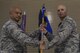 Colonel Rene M. Leon, 1st Special Operations Maintenance Group commander, and Maj. Jonathan E. Izworski,1st Special Operations Maintenance Squadron commander, raise the newly activated 1st SOMXS guidon, Aug. 10, 2015, at Hurlburt Field, Fla. During the ceremony, the 1st Special Operations Component Maintenance Squadron and the 1st Special Operations Equipment Maintenance Squadron deactivated and formed the newly activated 1st SOMXS. (U.S. Air Force photo by Airman 1st Class Ryan Conroy/Released)