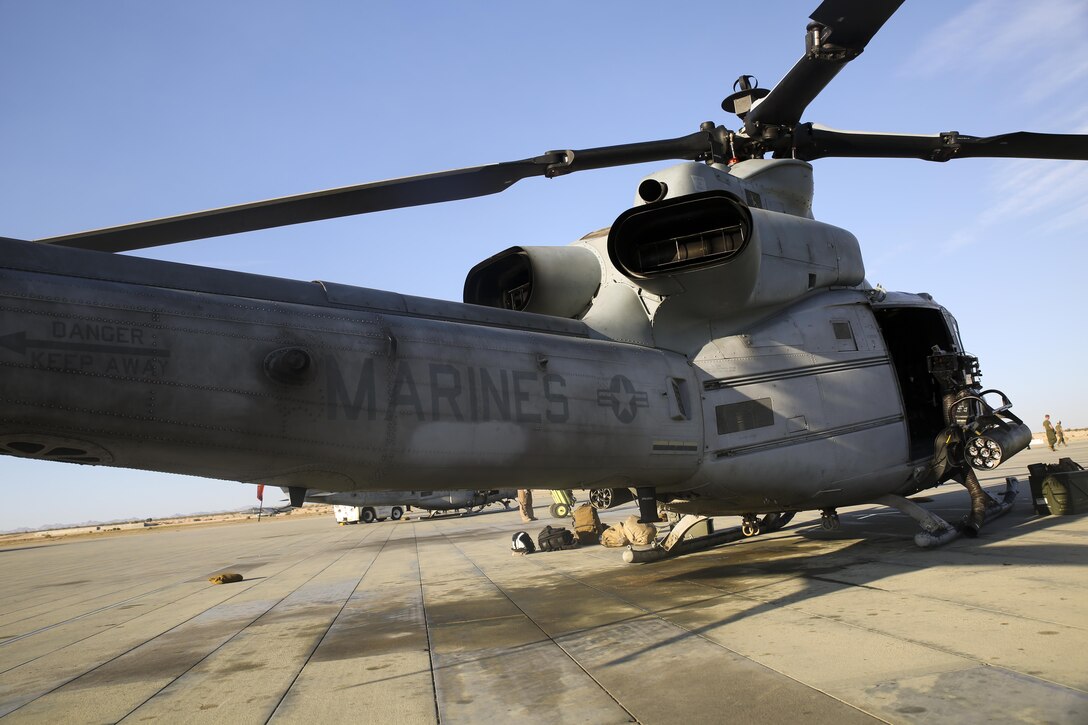 A UH-1Y helicopter is prepped prior to a close air support and escort exercise in preparation for Large Scale Exercise 15 aboard Marine Corps Air Ground Combat Training Center Twentynine Palms, Calif., Aug. 11, 2015. LSE-15 is a combined U.S. Marine Corps, Canadian and British exercise conducted at the Brigade-level, designed to enable live, virtual and constructive training for participating forces.