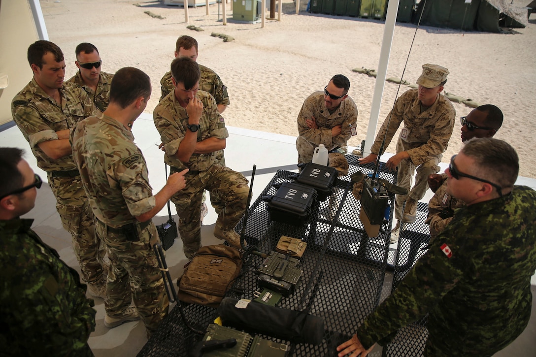 Servicemembers with 2nd Marine Expeditionary Brigade perform an interoperability communication test with their Canadian and British counterparts at Camp Wilson, Twentynine Palms, Calif., in support of the 2nd MEB Large Scale Exercise Aug. 7, 2015. LSE is a combined U.S. Marine Corps, Canadian, and British exercise conducted at the Brigade-level, designed to enable live, virtual and constructive training for participating forces.