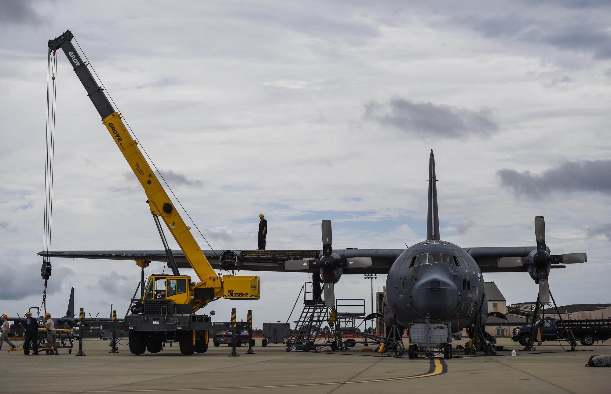 Airmen with the 1st Special Operations Wing and Robins Air Force Base, Ga., remove the wings from an MC-130P Combat Shadow on Hurlburt Field, Fla., Aug. 5, 2015. Wing removal enabled the MC-130P to be towed safely from the flightline to the Hurlburt Field Air Park Aug. 15, 2015. (U.S. Air Force photo by Airman Kai White/Released)