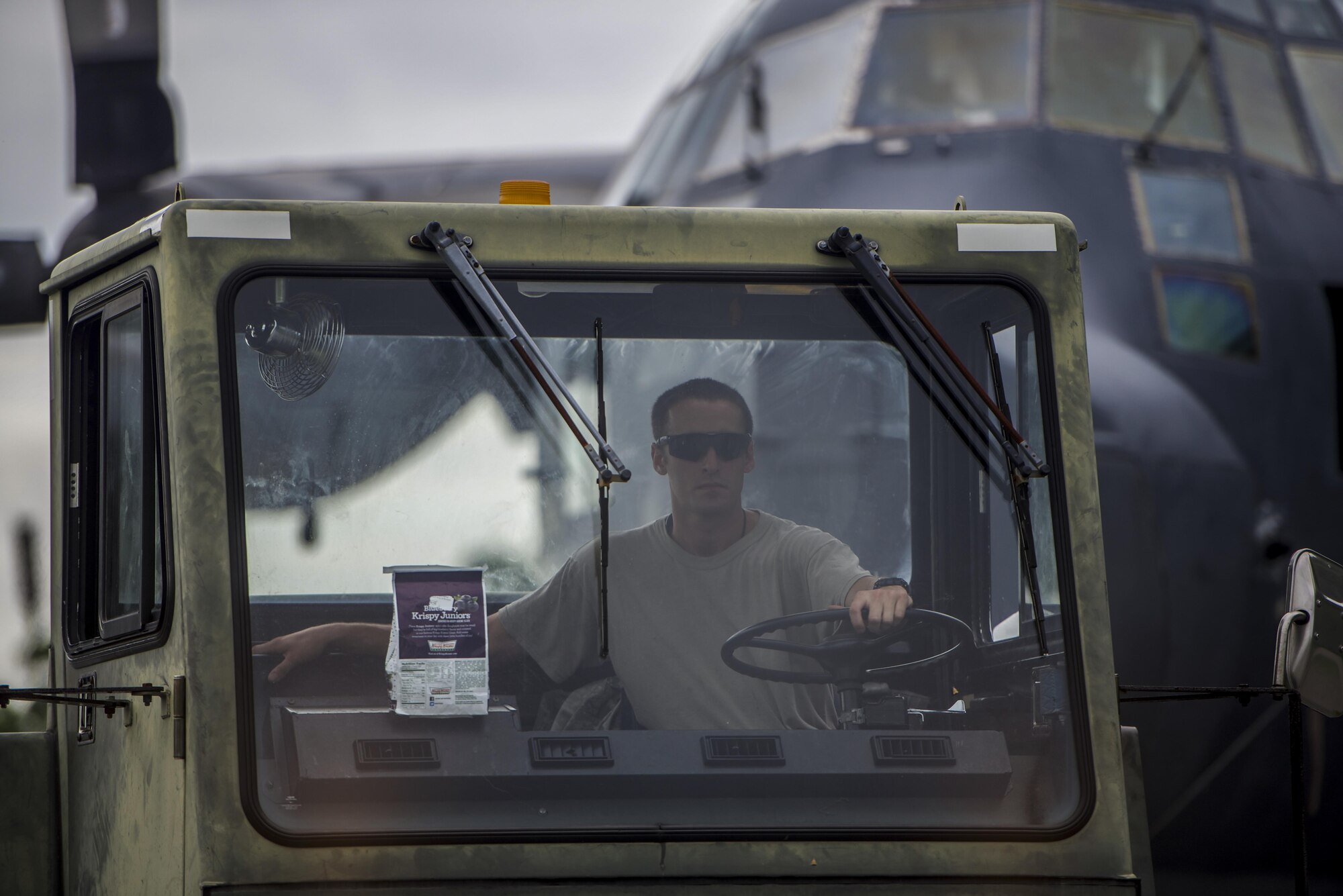 Staff Sgt. Jeffrey Minard, 901st Special Operations Aircraft Maintenance Squadron dedicated crew chief, tows an MC-130P Combat Shadow from the flightline to the Air Park on Hurlburt Field, Fla., Aug. 15, 2015. More than 40 personnel with eight base organizations were on site during the tow process. The MC-130P Combat Shadow known as “Team Shadow” will be displayed at the South end of the Air Park. (U.S. Air Force photo by Senior Airman Christopher Callaway/released)