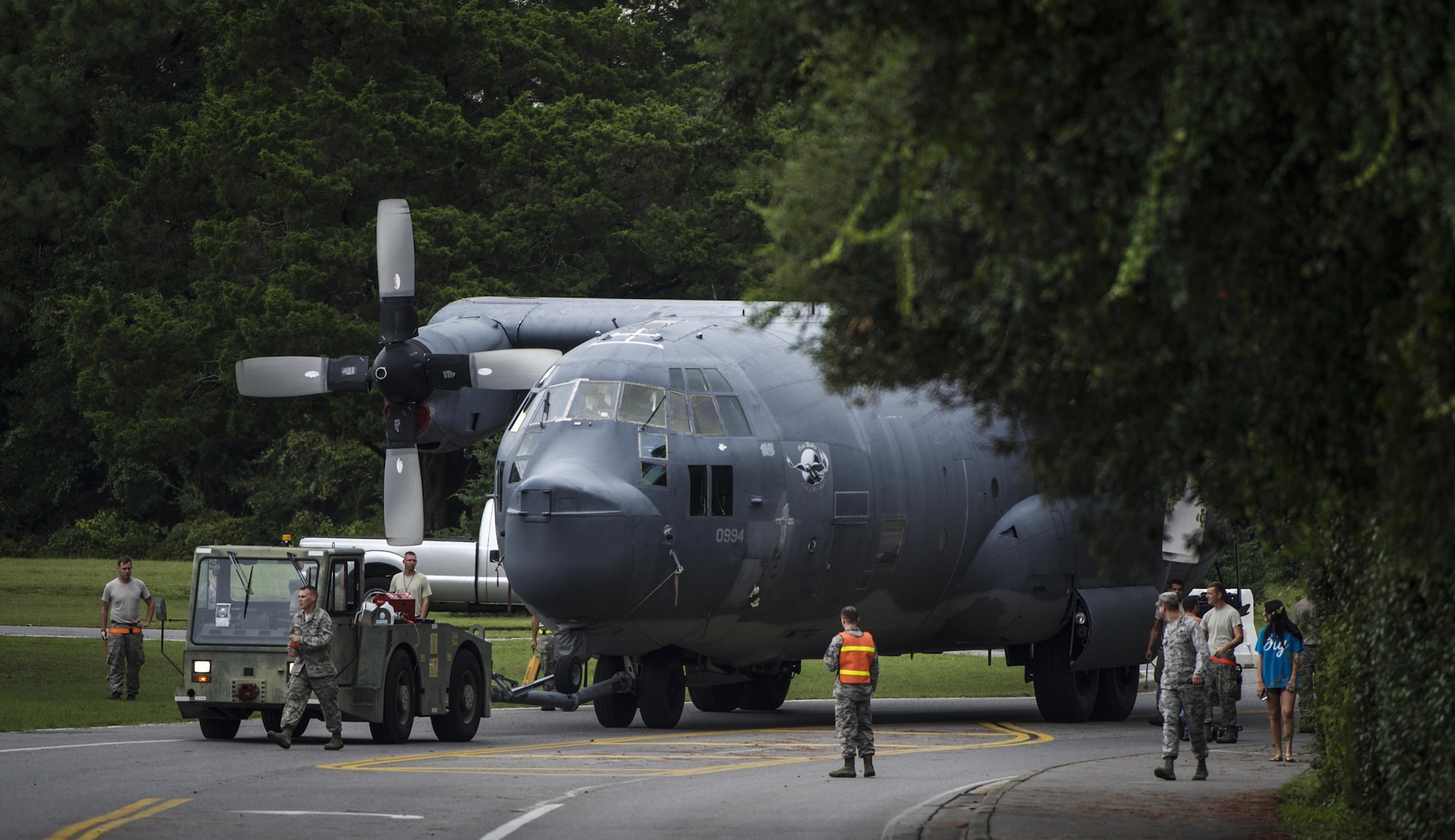 An MC-130P Combat Shadow is towed from the flightline to the Air Park where it will be installed and displayed on Hurlburt Field, Fla., Aug. 15, 2015.  The MC-130P fleet was retired May 15, 2015, after more than 25 years of service. The installation process for this aircraft known as “Team Shadow” is set to be complete by Sep. 6, 2015. (U.S. Air Force photo by Senior Airman Christopher Callaway/released)