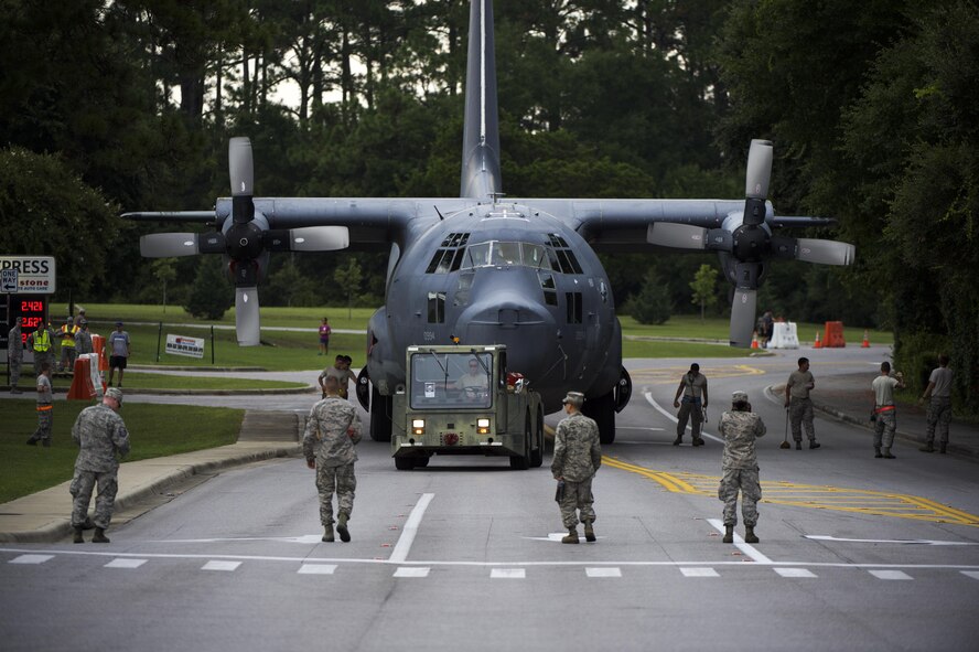 An MC-130P Combat Shadow is towed from the flightline to the Air Park where it will be installed and displayed on Hurlburt Field, Fla., Aug. 15, 2015.  The MC-130P fleet was retired May 15, 2015, after more than 25 years of service. The installation process for this aircraft known as “Team Shadow” is set to be complete by Sep. 6, 2015. (U.S. Air Force photo by Senior Airman Christopher Callaway/released)