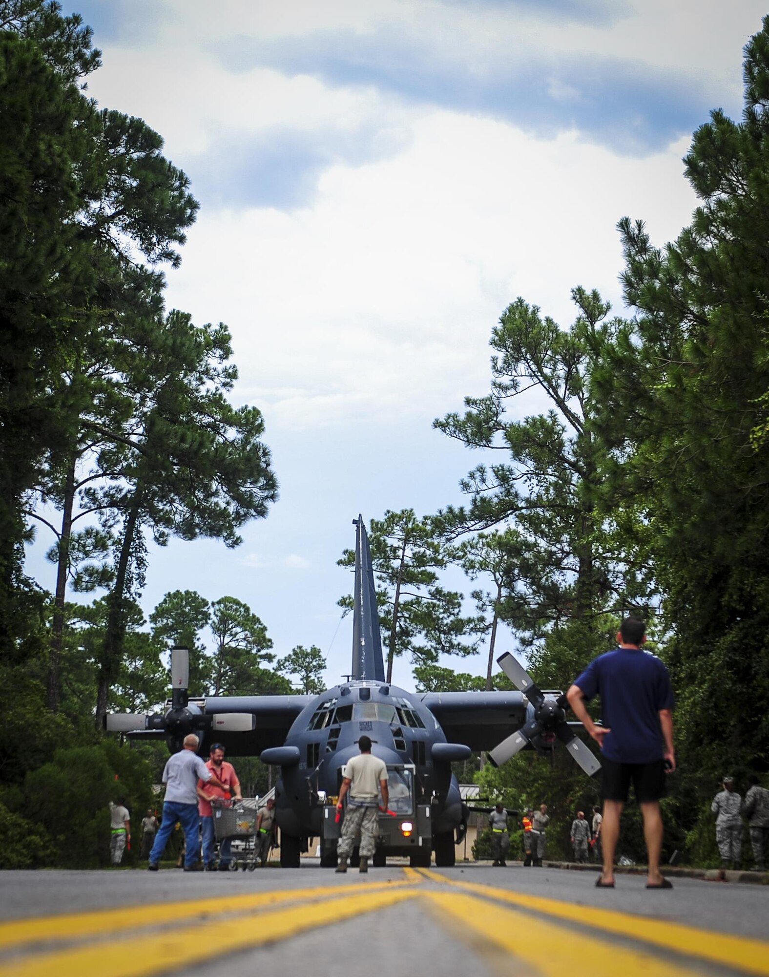 An AC-130H Spectre is towed down Independence Road on Hurlburt Field, Fla., Aug. 15, 2015. The Spectre was towed from the flightline and staged for installation in to the Hurlburt Field Air Park. The AC-130H fleet retired May 26, 2015, after more than 45 years of service. The installation process for this aircraft, known as “Wicked Wanda,” is set to be complete by Aug. 28, 2015. (U.S. Air Force photo by Senior Airman Meagan Schutter/Released)