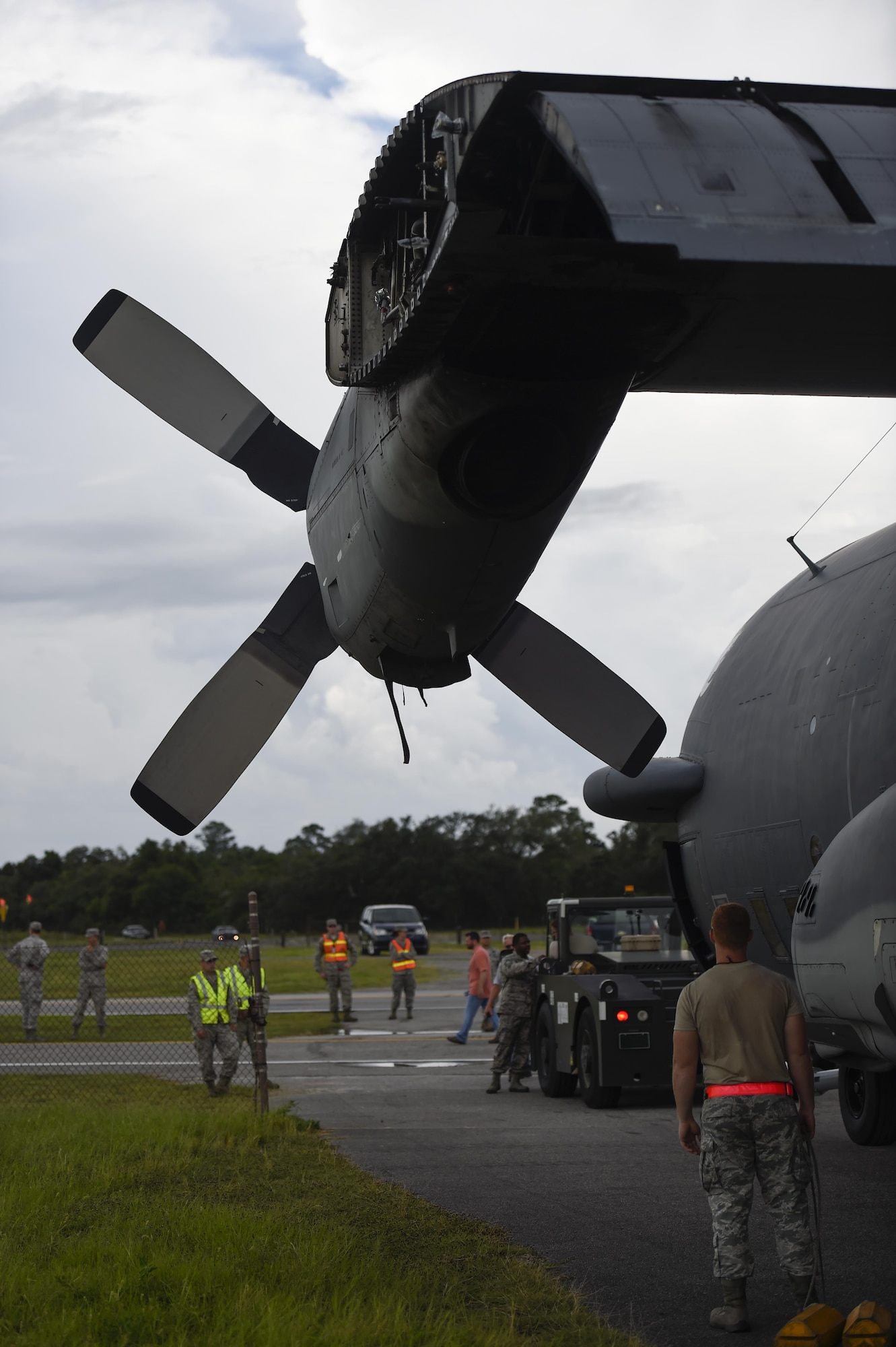 Airmen with the 1st Special Operations Wing prepare to tow an AC-130H Spectre to the Air Park on Hurlburt Field, Fla., Aug. 15, 2015. The Spectre was towed from the flightline and staged for installation in the Hurlburt Field Air Park. The AC-130H fleet retired May 26, 2015, after more than 45 years of service. The installation process for this aircraft, known as “Wicked Wanda,” is set to be complete by Aug. 28, 2015. (U.S. Air Force photo by Airman Kai White/Released)