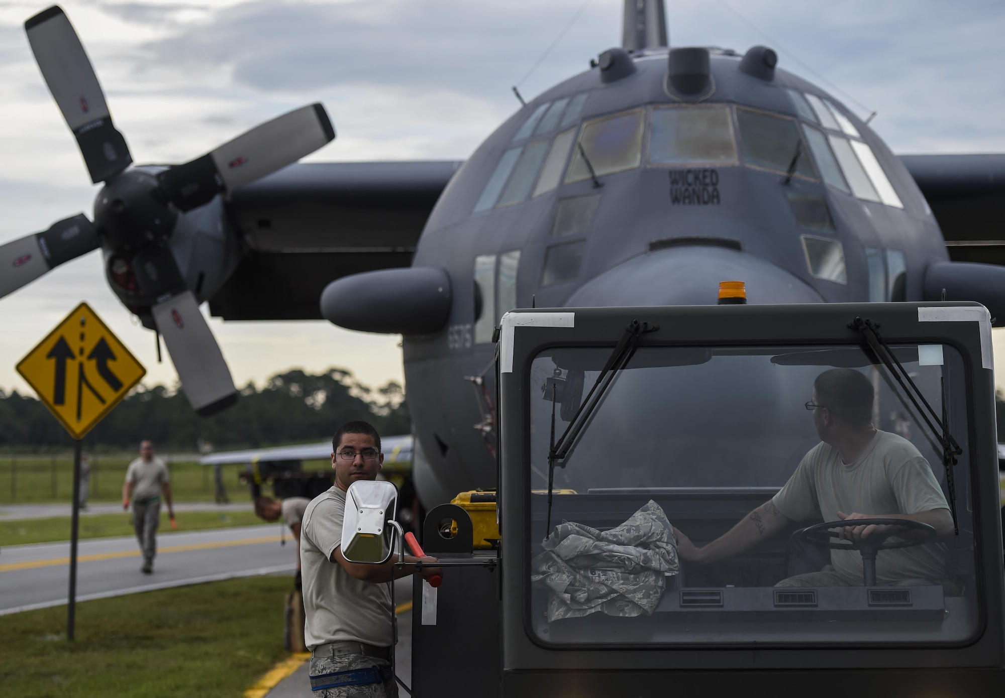 Airmen with the 1st Special Operations Aircraft Maintenance Squadron tow an AC-130H Spectre to the Air Park on Hurlburt Field, Fla., Aug. 15, 2015. The Spectre was towed from the flightline and staged for installation in the Hurlburt Field Air Park. The AC-130H fleet retired May 26, 2015, after more than 45 years of service. The installation process for this aircraft, known as “Wicked Wanda,” is set to be complete by Aug. 28, 2015. (U.S. Air Force photo by Airman Kai White/Released)