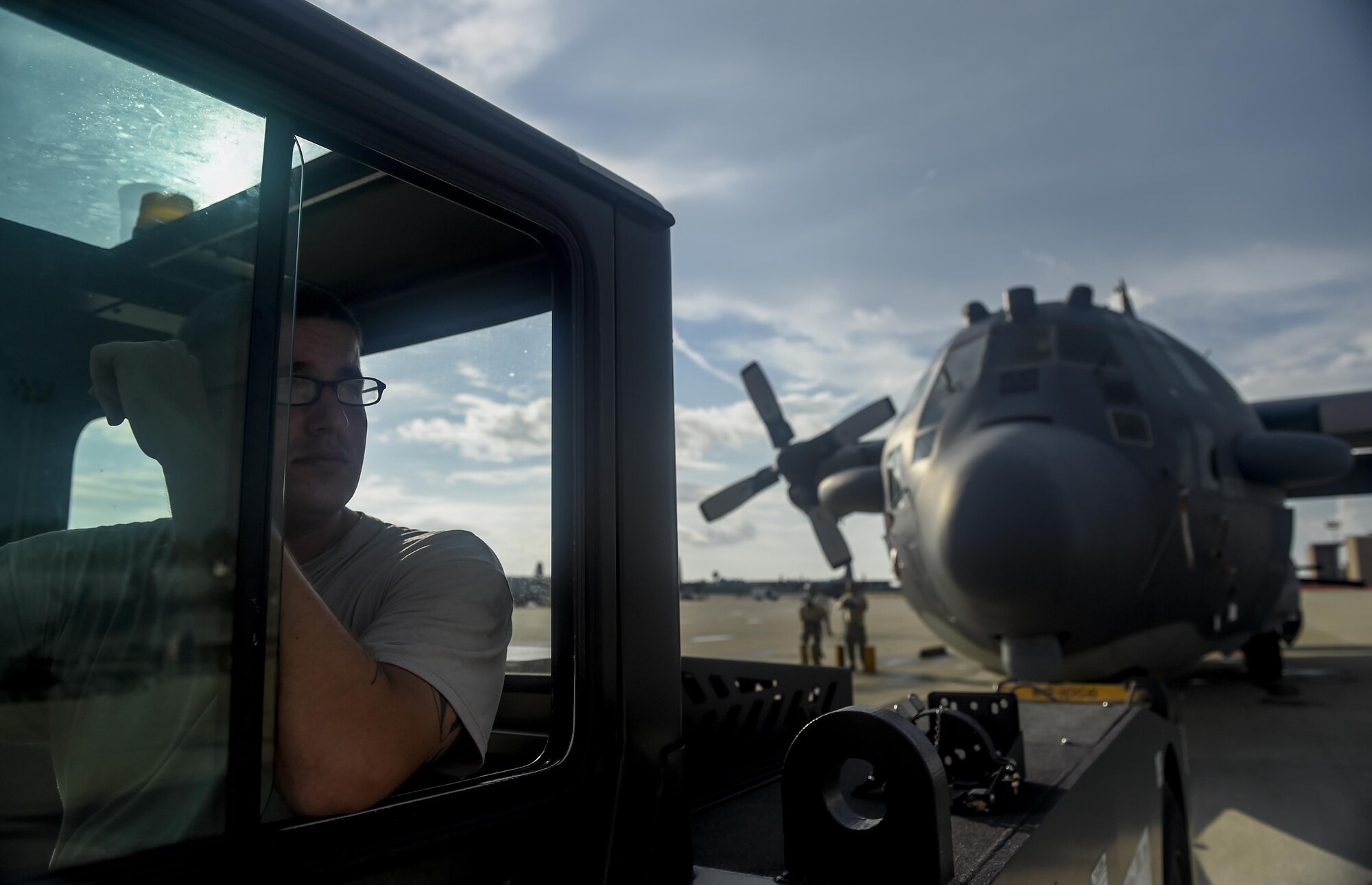 Airmen with the 1st Special Operations Aircraft Maintenance Squadron prepare to tow an AC-130H Spectre to the Air Park on Hurlburt Field, Fla., Aug. 15, 2015. The Spectre was towed from the flightline and staged for installation in the Hurlburt Field Air Park. The AC-130H fleet retired May 26, 2015, after more than 45 years of service. The installation process for this aircraft, known as “Wicked Wanda,” is set to be complete by Aug. 28, 2015. (U.S. Air Force photo by Airman Kai White/Released)