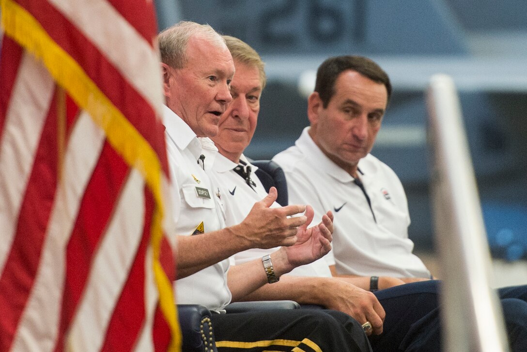 Army Gen. Martin E. Dempsey, chairman of the Joint Chiefs of Staff, Jerry Colangelo, USA Basketball Men’s National Team managing director, and Coach Mike Krzyzewskiat hold a leadership panel discussion with the airmen at Nellis Air Force Base, Nev., Aug. 13, 2015.