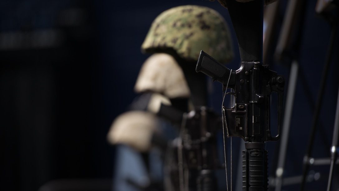 Battle crosses are mounted on stage at the Mckenzie Arena at the University of Tennessee at Chattanooga, Aug. 15, 2015. The battle crosses are symbolic replacements for crosses for service members who have fallen in the line of duty. Four Marines and one sailor died during a shooting in Chattanooga, Tennessee, July 16, 2015. 