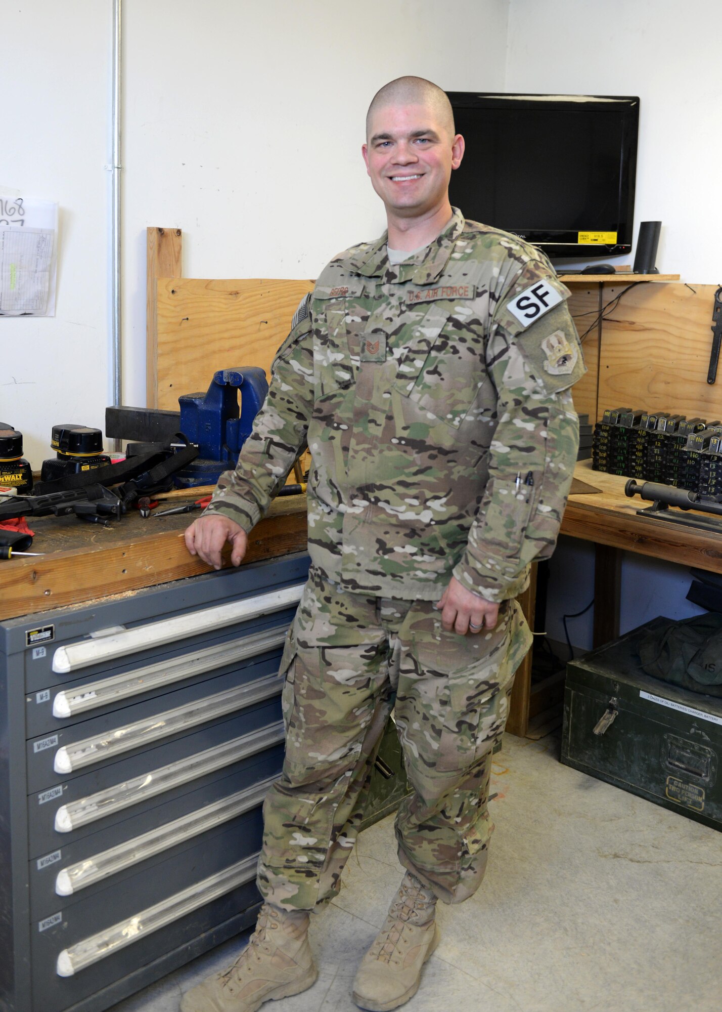 U.S. Air Force TSgt. Kevin Beers, 455th Expeditionary Security Forces Squadron combat arms instructor, poses for a photo Aug. 10, 2015, at Bagram Airfield, Afghanistan. As Bagram’s only weapons repairman, Beers is responsible for repairing weapons for the security forces squadron, logistics readiness squadron, Marines and all other units here. (U.S. Air Force photo by Senior Airman Cierra Presentado/Released)