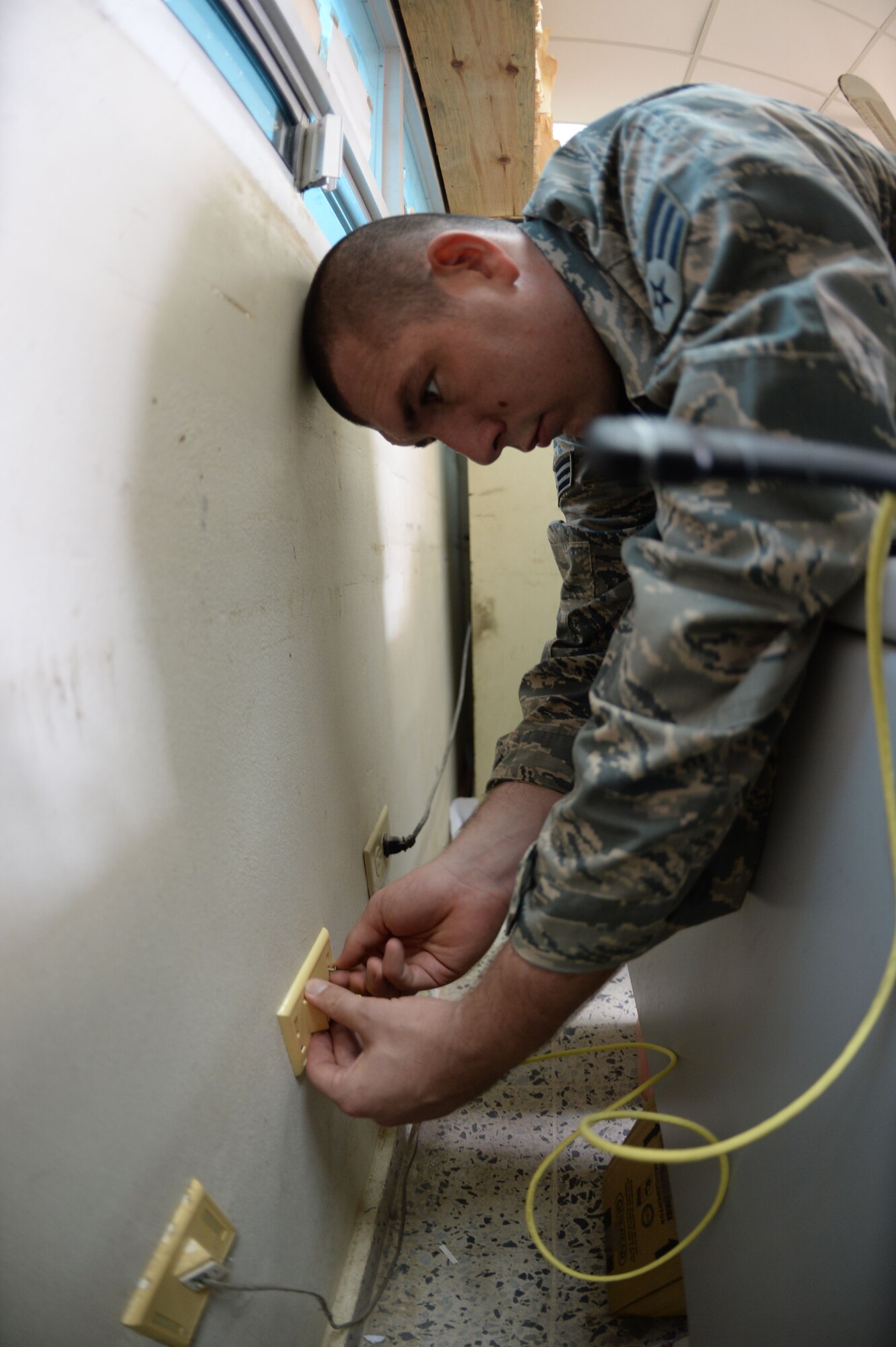 U.S. Air Force Senior Airman Christopher Harkins 35th Combat Communications Squadron radio frequency transmissions craftsman, checks an ethernet port at the Dr. Salvador Paredes Hospital in Trujillo, Honduras, July 9, 2015, Harkins is in the hospital to repair its ailing network infrastructure as part of the New Horizons Honduras 2015 training exercise. 

New Horizons was launched in the 1980s and is an annual joint humanitarian assistance exercise that U.S. Southern Command conducts with a partner nation in Central America, South America or the Caribbean. The exercise improves joint training readiness of U.S. and partner nation civil engineers, medical professionals and support personnel through humanitarian assistance activities.

(U.S. Air Force photo by Capt. David J. Murphy/Released)