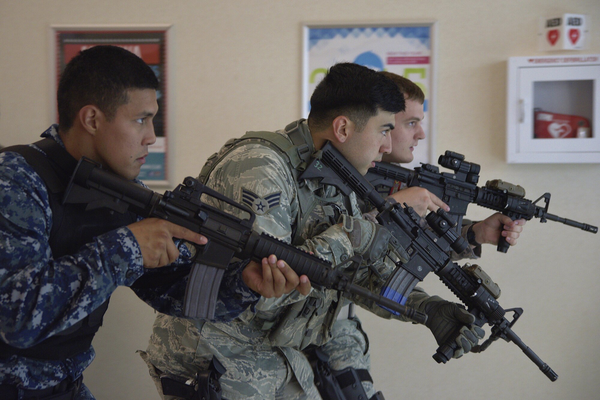 A security response team makes its way through the Base Exchange in search of an active-shooter during a training exercise at Misawa Air Base, Japan, Aug. 14, 2015. From the moment they respond to a scene, security personnel must be on guard and move in tactical formation ensuring their safety and the safety of all around them. (U.S. Air Force photo by Senior Airman Jose L. Hernandez-Domitilo/Released)