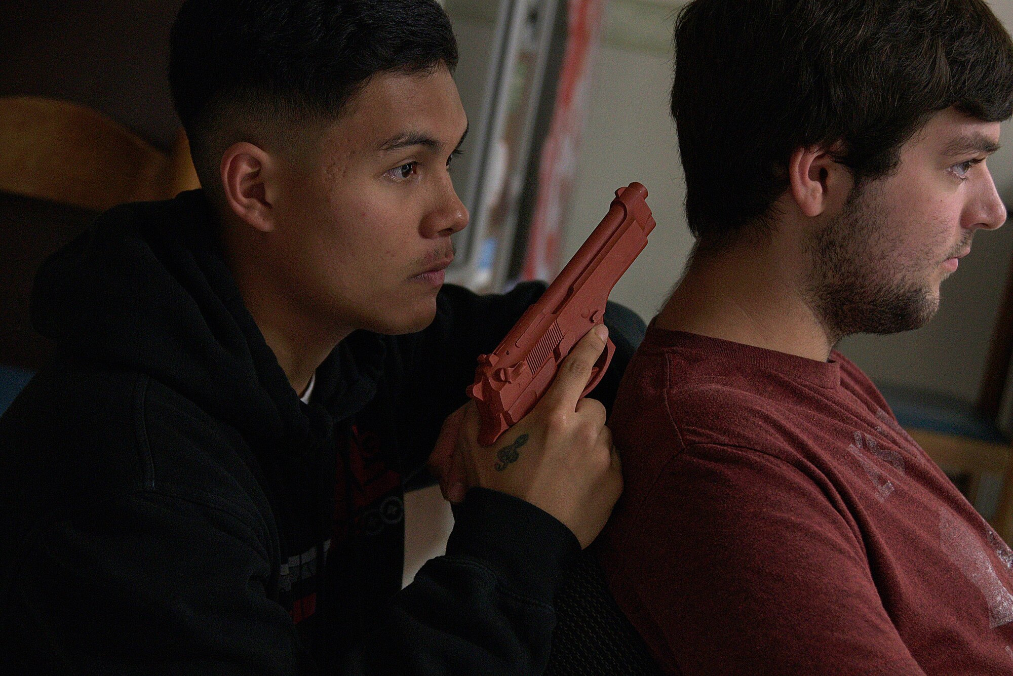 A gunman holds an individual hostage during an active-shooter threat exercise at Misawa Air Base, Japan, Aug. 15, 2015. Security response personnel must take appropriate measures to ensure the safety of bystanders caught in the crossfire. (U.S. Air Force photo by Senior Airman Jose L. Hernandez-Domitilo/Released)