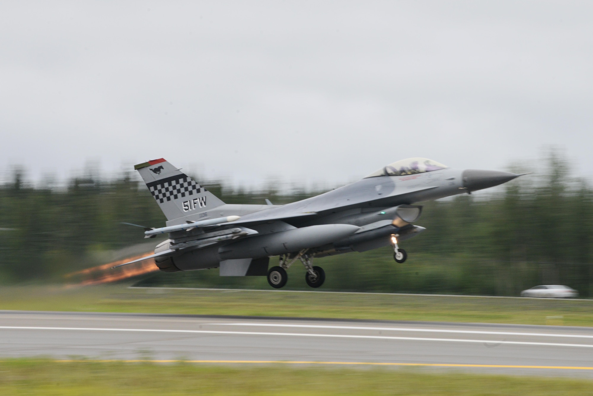 A U.S. Air Force F-16 Fighting Falcon assigned to the 36th Fighter Squadron, Osan Air Base, Republic of Korea, takes off from Eielson Air Force Base, Alaska, Aug. 10, 2015, during RED FLAG-Alaska 15-3. RF-A is a series of Pacific Air Forces commander-directed field training exercises for U.S. and partner nation forces, providing combined offensive counter-air, interdiction, close air support and large force employment training in a simulated combat environment. (U.S. Air Force photo by Senior Airman Ashley Nicole Taylor/Released)
