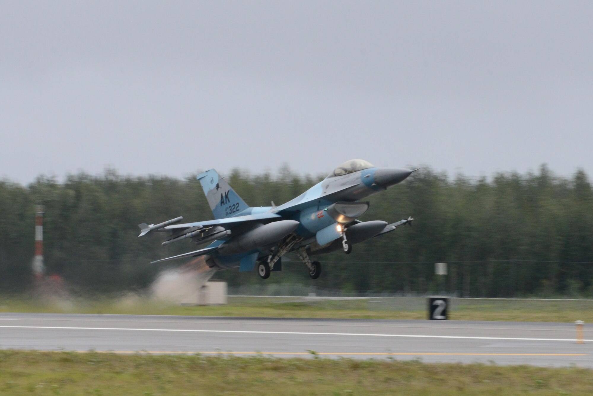 A U.S. Air Force F-16 Fighting Falcon assigned to the 18th Aggressor Squadron takes off from Eielson Air Force Base, Alaska, Aug. 10, 2015, during RED FLAG-Alaska 15-3. RF-A is a series of Pacific Air Forces commander-directed field training exercises for U.S. and partner nation forces, providing combined offensive counter-air, interdiction, close air support and large force employment training in a simulated combat environment. (U.S. Air Force photo by Senior Airman Ashley Nicole Taylor/Released)