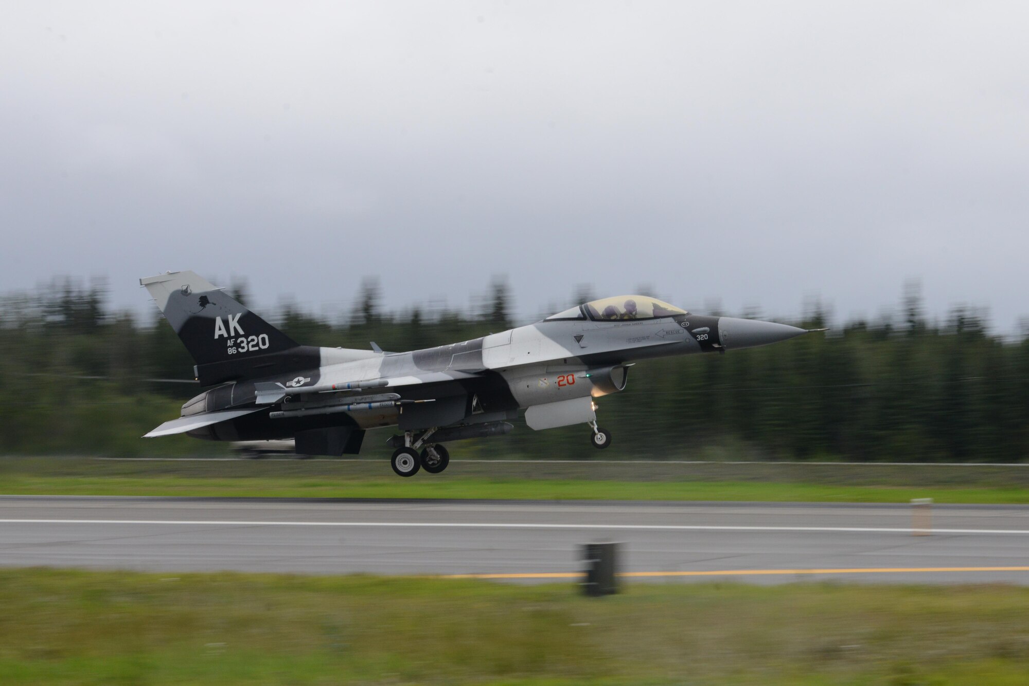 A U.S. Air Force F-16 Fighting Falcon assigned to the 18th Aggressor Squadron takes off from Eielson Air Force Base, Alaska, Aug. 10, 2015, during RED FLAG-Alaska 15-3. RF-A is a series of Pacific Air Forces commander-directed field training exercises for U.S. and partner nation forces, providing combined offensive counter-air, interdiction, close air support and large force employment training in a simulated combat environment. (U.S. Air Force photo by Senior Airman Ashley Nicole Taylor/Released)