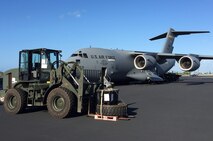 A forklift stands ready to be loaded aboard a U.S. Air Force C-17 Globemaster III from the 535the Airlift Squadron bound for Saipan, Aug. 8, 2015, Joint Base Pearl Harbor-Hickam, Hawaii. In addition to providing airlift support, Pacific Air Forces also deployed six Airmen with the 36th Contingency Response Group from Andersen Air Force Base, Guam, to Saipan to help unload Federal Emergency Management Agency-contracted cargo planes at the airport. This equipment further enhanced the capabilities available to personnel supporting relief efforts in Saipan. (U.S. Air Force courtesy photo/Released)