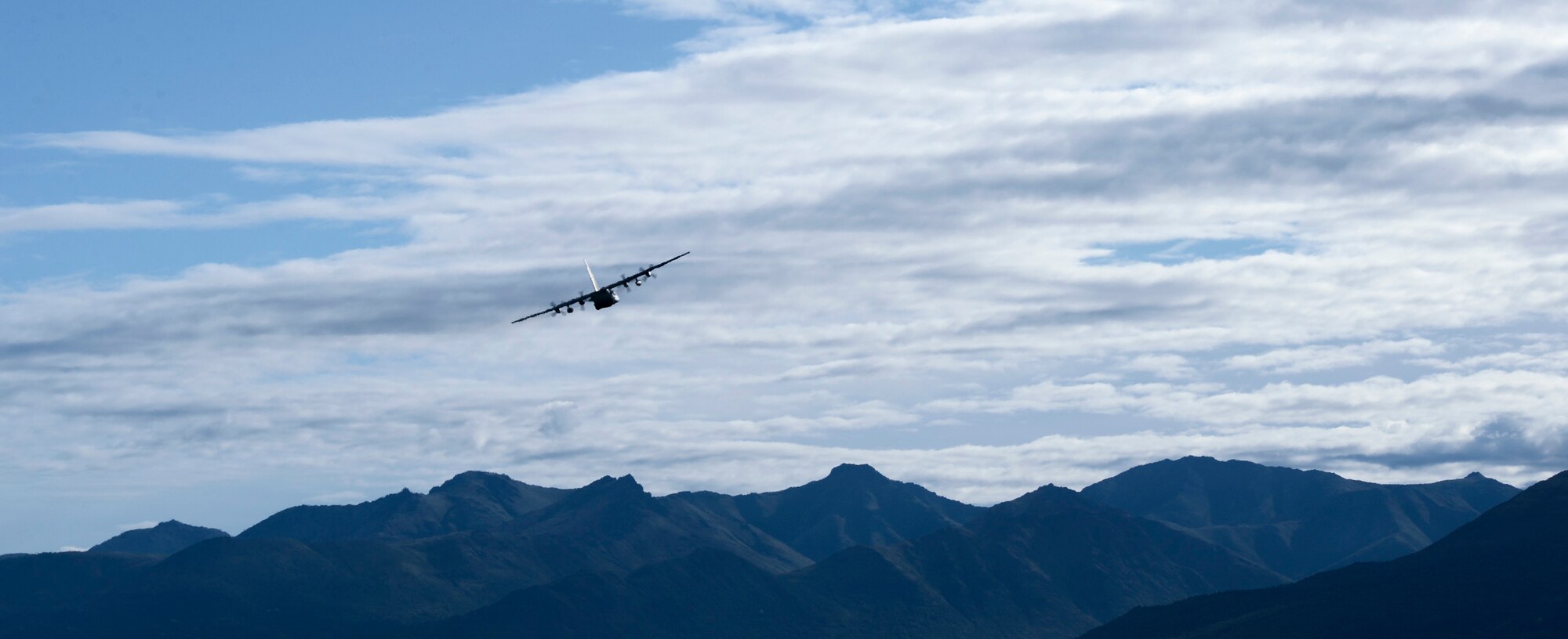 A U.S. Air Force C-130 Hercules with the 36th Airlift Squadron from Yokota Air Base, Japan, takes off during Red Flag-Alaska at Joint Base Elmendorf-Richardson, Alaska, Aug. 11, 2015. Red Flag-Alaska is an exercise that provides joint offensive counter-air, interdiction, close air support and large force employment training in a simulated combat environment. More than 20 allied countries have participated in Red Flag-Alaska since its conception, improving integration, interoperability and cross-cultural competence. (U.S. Air Force photo by Staff Sgt. Cody H. Ramirez/Released)