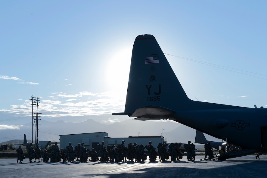 U.S. Army Soldiers with the 1st Battalion (Airborne), 501st Infantry Regiment, and Japan Ground Self-Defense Force members board a U.S. Air Force C-130 Hercules from Yokota Air Base, Japan, during Red Flag -Alaska at Joint Base Elmendorf-Richardson, Alaska, Aug. 12, 2015. Red Flag -Alaska is an exercise that provides joint offensive counter-air, interdiction, close air support and large force employment training in a simulated combat environment. More than 20 allied countries have participated in Red Flag-Alaska since its conception, improving integration, interoperability and cross-cultural competence. (U.S. Air Force photo by Staff Sgt. Cody H. Ramirez/Released)