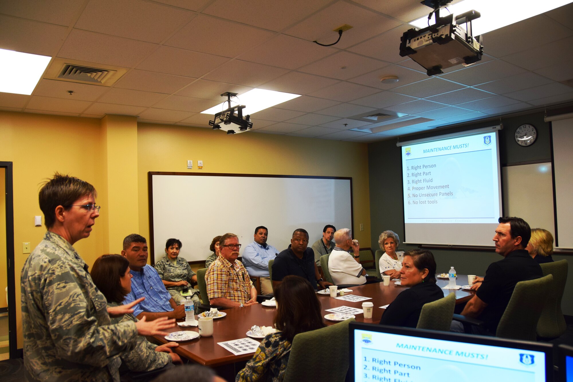 Col. Gretchen Wiltse (left), 433rd Maintenance Group commander,  gives a mission briefing about the impact her Airman have on the Air Force mission to  honorary commanders on Aug. 15, 2015 at Joint Base San Antonio-Lackland, Texas.  The group toured a static of a C-5A Galaxy on the flightline and visited the maintenance shops to learn how Reservists contribute to the Air Force mission. (U.S. Air Force photo by Tech. Sgt. Carlos J. Trevino)
