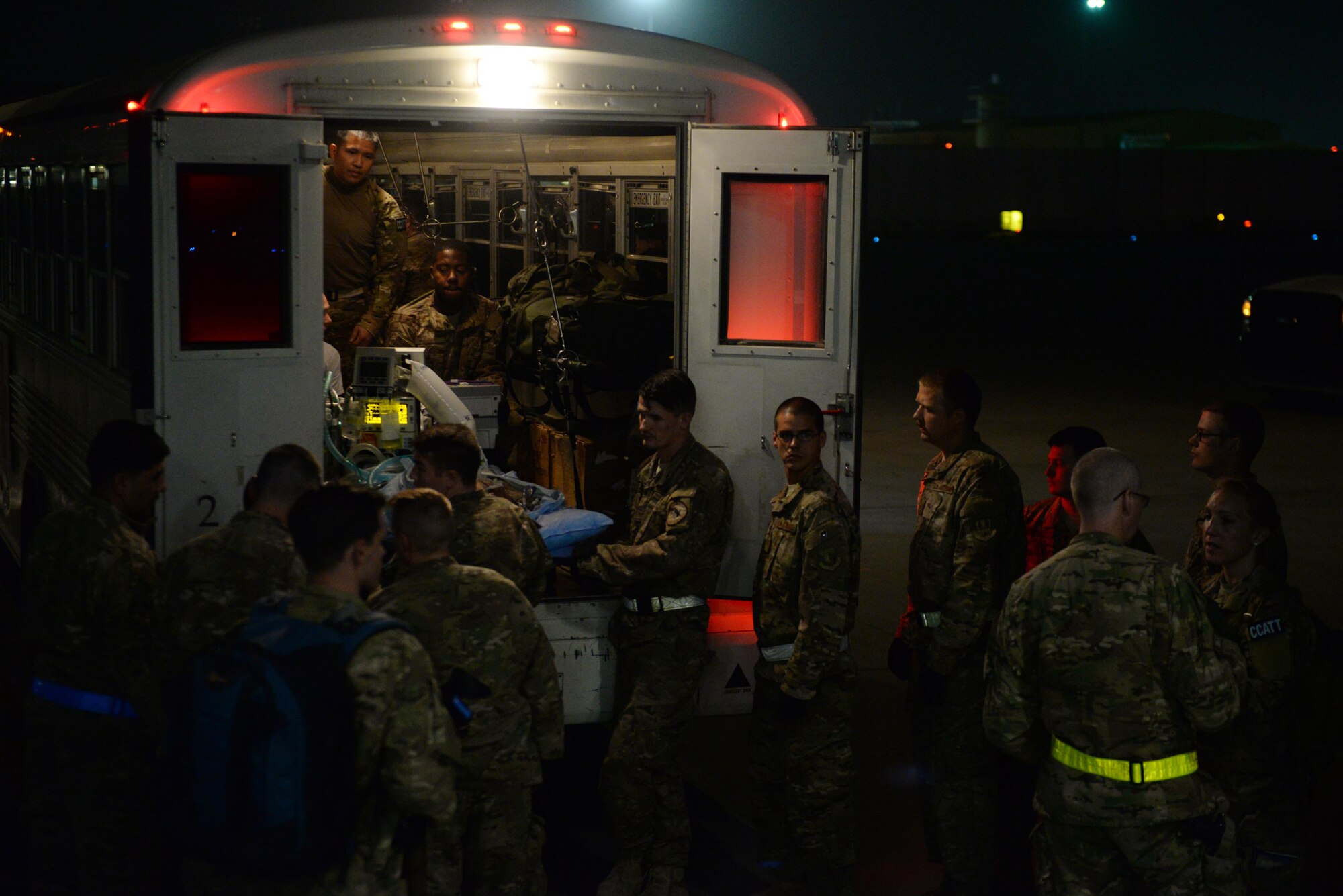 U.S. Airmen assigned to the 455th Expeditionary Aeromedical Evacuation Squadron and the 455th Expeditionary Medical Group prepare to receive injured Service members and load them onto a C-17 Globemaster III aircraft on the flight line at Bagram Airfield, Afghanistan, Aug. 8, 2015.  The 455th EAES Airmen are charged with the responsibility of evacuating the sick and wounded from Central Command to higher echelons of medical care. (U.S. Air Force photo by Maj. Tony Wickman/Released) 