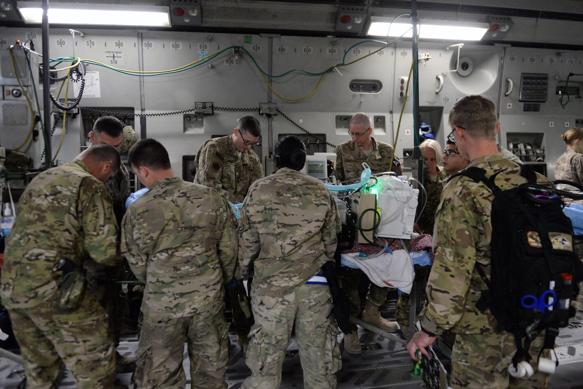 U.S. Airmen assigned to the 455th Expeditionary Aeromedical Evacuation Squadron and 455th Expeditionary Medical Group load an injured Service member onto a C-17 Globemaster III aircraft on the flight line at Bagram Airfield, Afghanistan, Aug. 8, 2015.  The 455th EAES Airmen are charged with the responsibility of evacuating the sick and wounded from Central Command to higher echelons of medical care. (U.S. Air Force photo by Maj. Tony Wickman/Released) 
