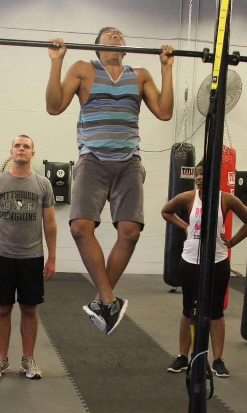 Eric Cruz-Pena, a poolee with Recruiting Sub-station Raleigh, performs pull-ups during physical training in Wake Forest, North Carolina, July 29, 2015. Cruz-Pena is a second generation immigrant and is looking to give back to the country that gave his family so much. He is scheduled to ship to recruit training at Marine Corps Recruit Depot Parris Island, South Carolina in August.  (U.S. Marine Corps photo by Sgt. Dwight A. Henderson/Released)