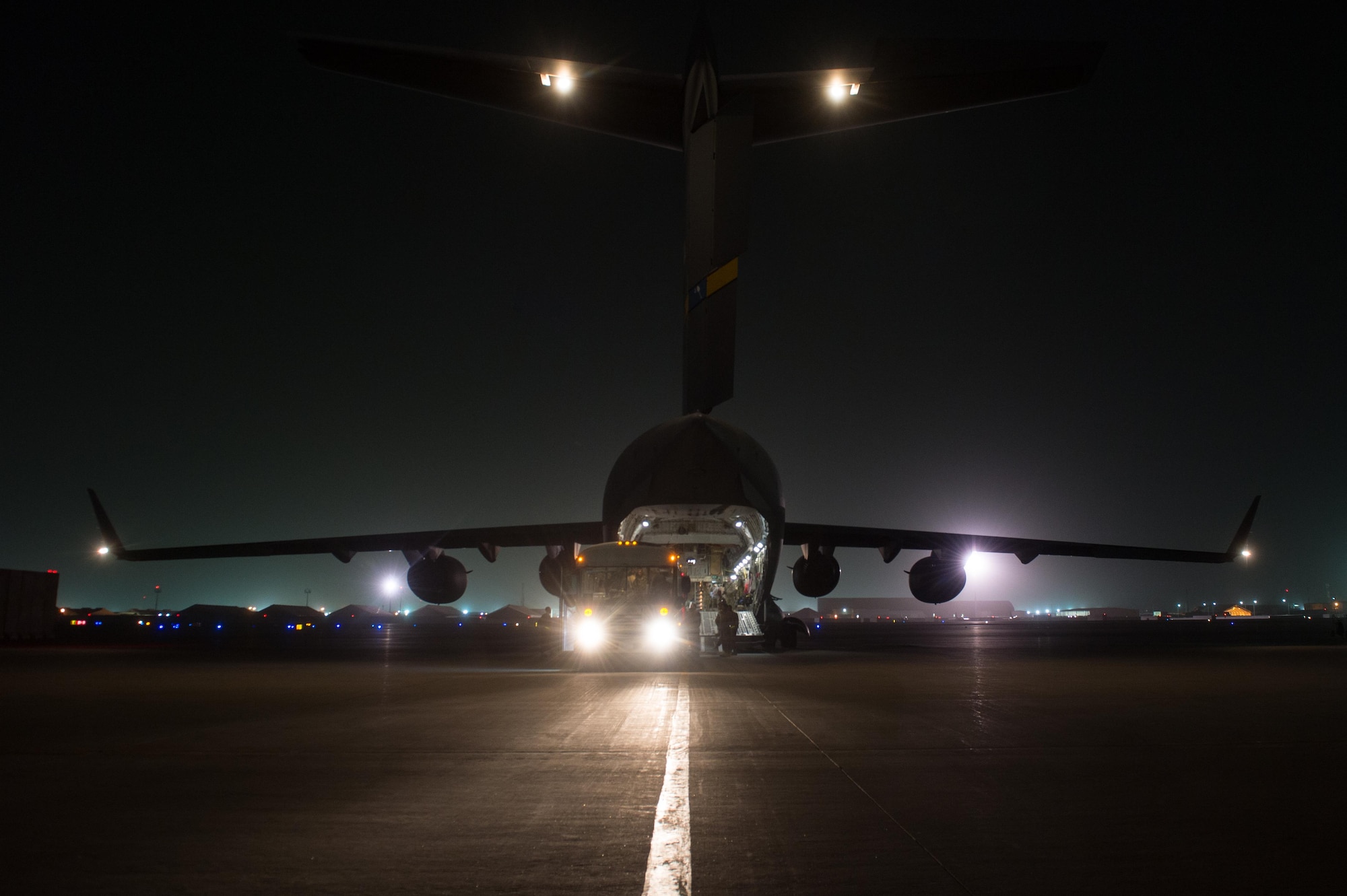 U.S. Airmen assigned to the 455th Expeditionary Aeromedical Evacuation Squadron and the 455th Expeditionary Medical Group load injured Service members onto a C-17 Globemaster III aircraft on the flight line at Bagram Airfield, Afghanistan, Aug. 8, 2015.  The 455th EAES Airmen are charged with the responsibility of evacuating the sick and wounded from Central Command to higher echelons of medical care. (U.S. Air Force photo by Tech. Sgt. Joseph Swafford/Released) 