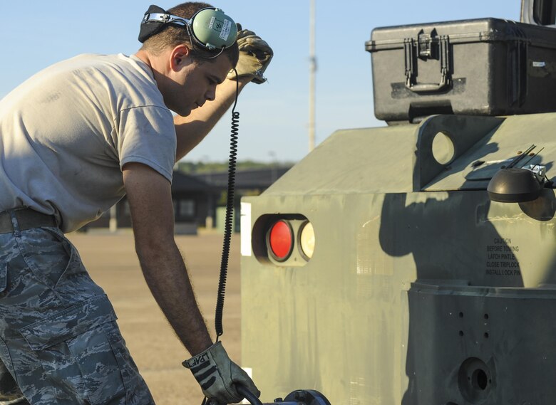 Tech. Sgt. Timothy Hammonds, a 913th Maintenance Squadron C-130H crew chief, attaches a C-130 hitch to a towing truck August 4, 2015, at Little Rock Air Force Base, Ark. The C-130H assigned to Hammonds recently received a black-letter initial status after landing with zero maintenance discrepancies. (U.S. Air Force photo by Senior Airman Harry Brexel)
