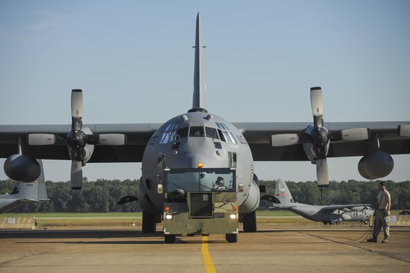 Airmen from the 913th Maintenance Squadron tow a C-130H to a nearby hangar August 4, 2015, at Little Rock Air Force Base, Ark. The C-130 is capable of operating from rough, dirt strips and fulfills a wide range of operational missions in peace and wartime situations. (U.S. Air Force photo by Senior Airman Harry Brexel) 