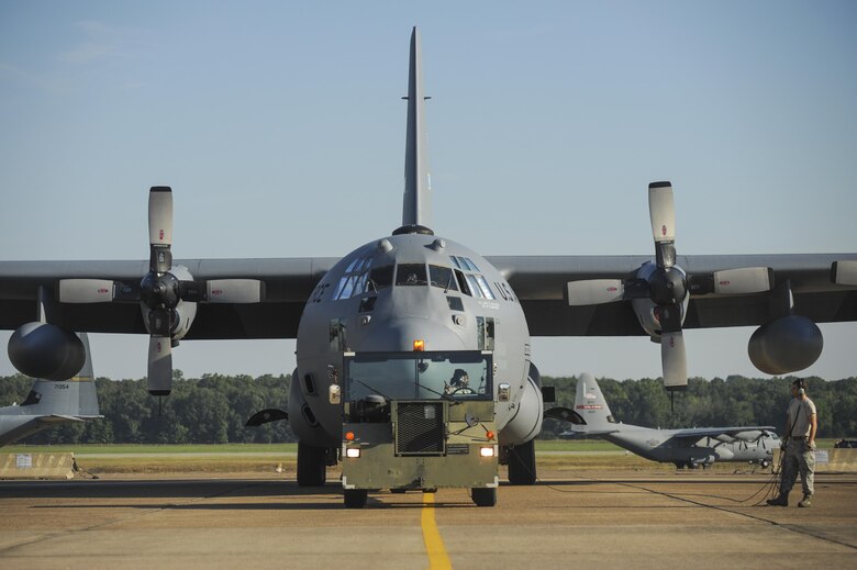 Airmen from the 913th Maintenance Squadron tow a C-130H to a nearby hangar August 4, 2015, at Little Rock Air Force Base, Ark. The C-130 is capable of operating from rough, dirt strips and fulfills a wide range of operational missions in peace and wartime situations. (U.S. Air Force photo by Senior Airman Harry Brexel) 