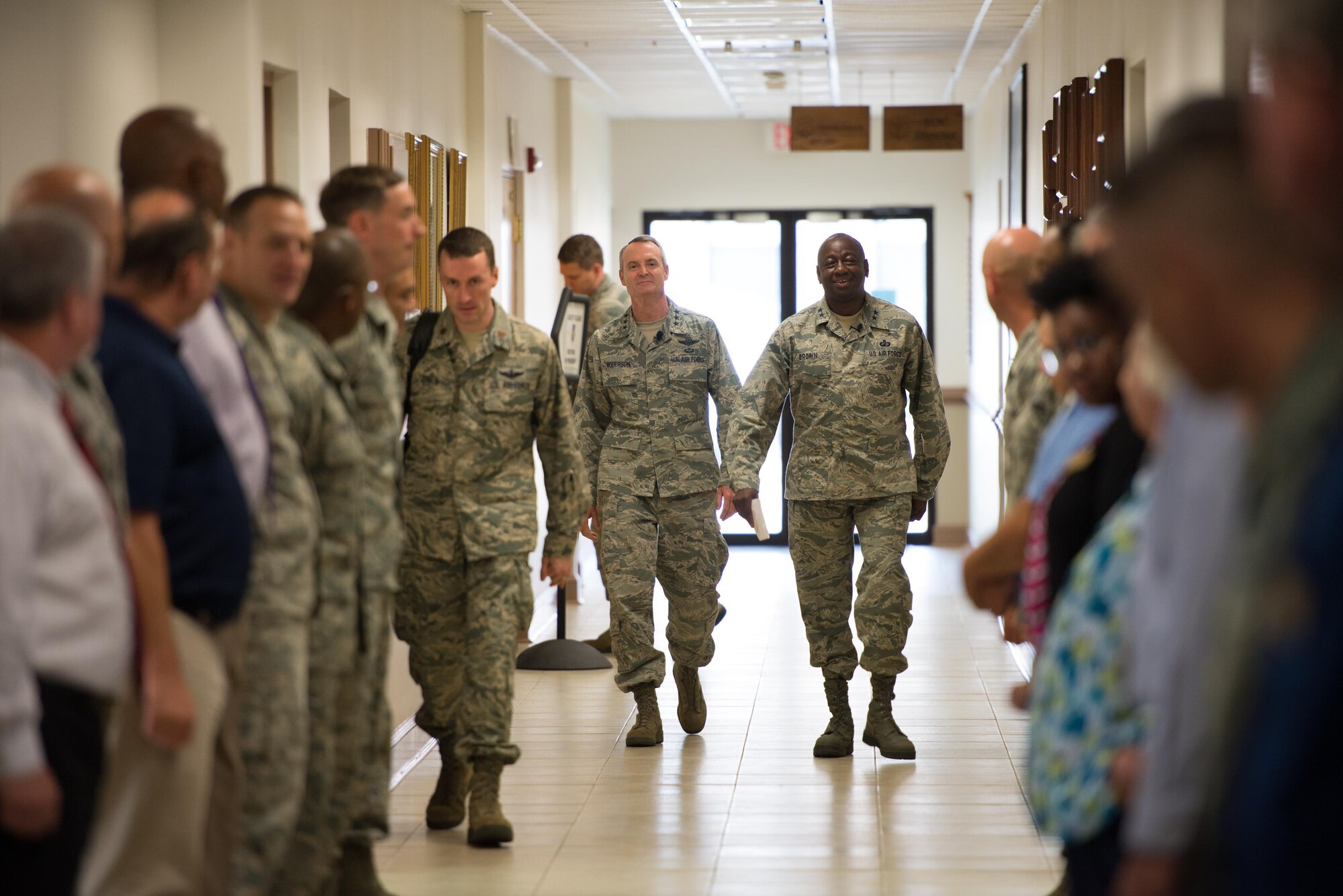 Lt. Gen. Darryl Roberson, commander of Air Education and Training Command, is escorted by Maj. Gen. Mark Brown, 2nd Air Force commander, to a hall call meet and greet with 2nd AF personnel Aug. 11, 2015, at Keesler Air Force Base, Mississippi. During Roberson’s two-day site visit to Keesler he also toured the 81st Medical Group, Levitow Training Support Facility and Trainer Development Center while accompanied by his wife, Cheryl, and Chief Master Sgt. Gerardo Tapia, AETC command chief. (U.S. Air Force photo by Marie Floyd)