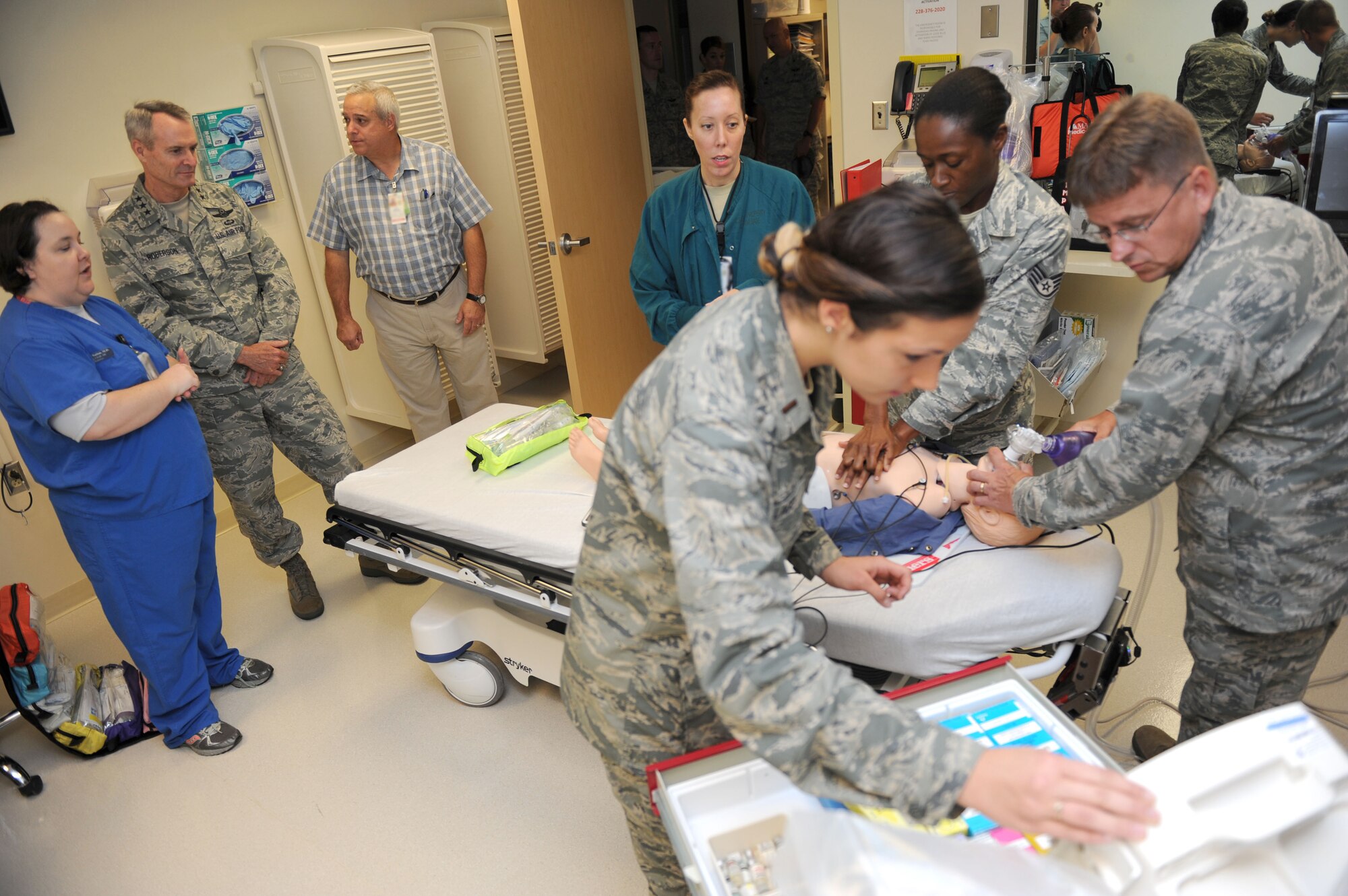 Lt. Gen. Darryl Roberson, commander of Air Education and Training Command, watches a triage simulation scenario performed by members of the 81st Medical Group at the Keesler Medical Center during a site visit, Aug. 12, 2015 Keesler Air Force Base, Mississippi. Roberson was accompanied by his wife, Cheryl, and Chief Master Sgt. Gerardo Tapia, AETC command chief. The two-day visit also included a base all call and tours of the Levitow Training Support Facility, the Trainer Development Center and 2nd Air Force headquarters. (U.S. Air Force photo by Kemberly Groue)