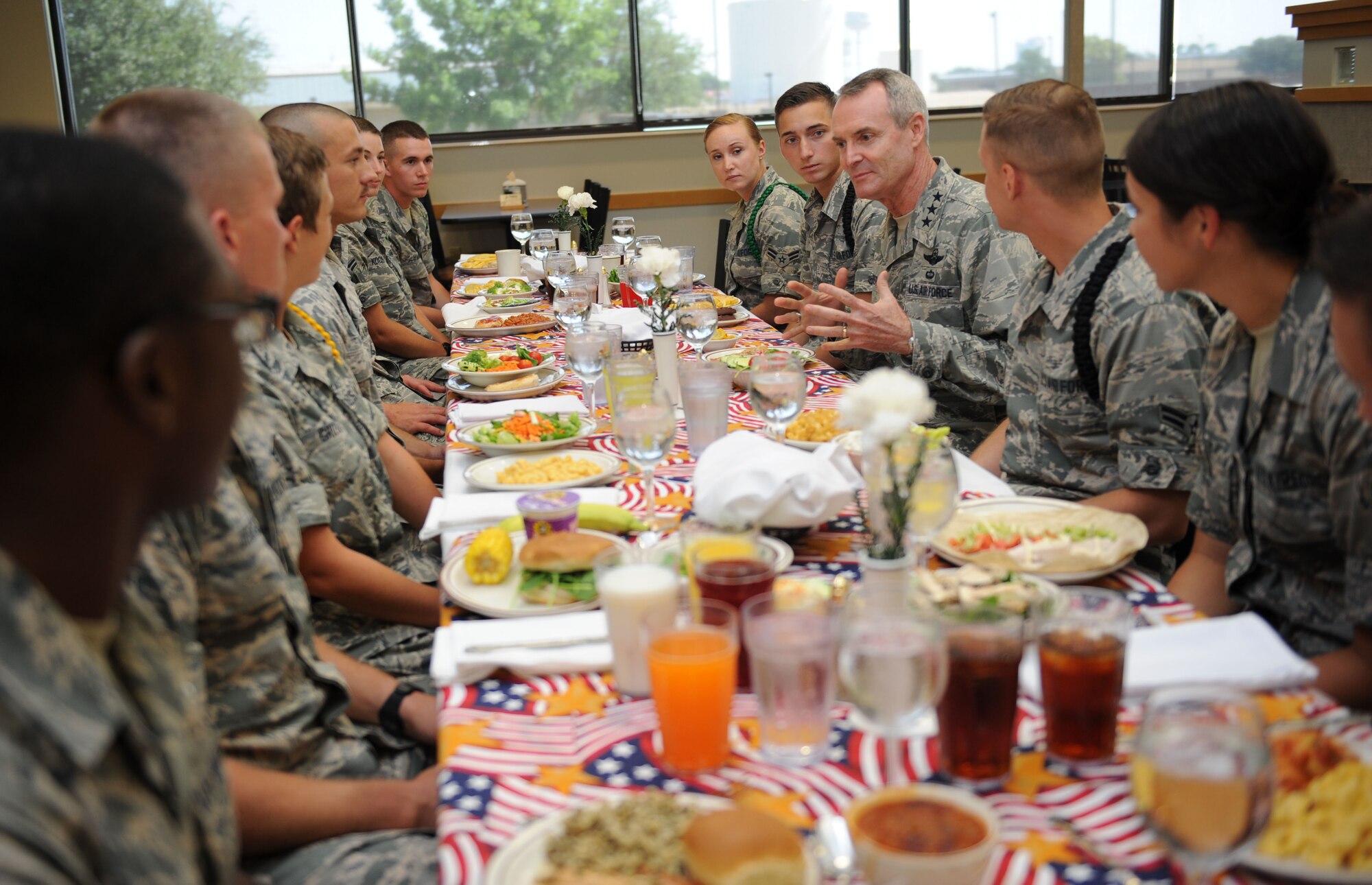Lt. Gen. Darryl Roberson, commander of Air Education and Training Command, participates in a group discussion with Airmen from the 81st Training Group during lunch at the Azalea Dining Facility during a site visit, Aug. 12, 2015, Keesler Air Force Base, Mississippi. Roberson was also accompanied by his wife, Cheryl, and Chief Master Sgt. Gerardo Tapia, AETC command chief. The two-day visit also included a base all call and tours of the 81st Medical Group, the Levitow Training Support Facility, the Trainer Development Center and 2nd Air Force headquarters. (U.S. Air Force photo by Kemberly Groue)